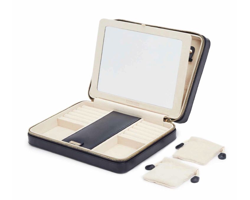 MARIA LARGE ZIP CASE, Material: Leather
Storage: 10 ring rolls, 2 open compartments, 1 lidded compartment, 2 drawstring pouches, 6 necklace snap-on hooks with pocket, 1 ring bar, one earring bar.
LusterLoc™: Allows the fabric lining the inside of your jewellery cases to absorb the hostile gases known to cause tarnishing. Under typical storage conditions, it can prevent tarnishing for up to 35 years
, Gifts, WOLF DESIGNS, INC