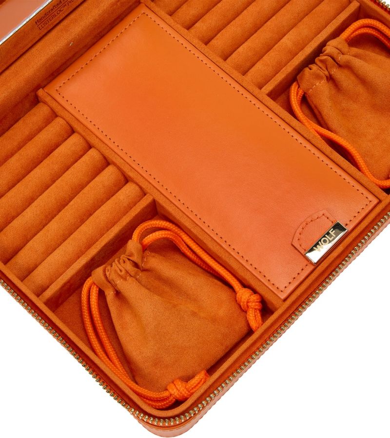 MARIA LARGE ZIP CASE, Material: Leather
Storage: 10 ring rolls, 2 open compartments, 1 lidded compartment, 2 drawstring pouches, 6 necklace snap-on hooks with pocket, 1 ring bar, one earring bar.
LusterLoc™: Allows the fabric lining the inside of your jewellery cases to absorb the hostile gases known to cause tarnishing. Under typical storage conditions, it can prevent tarnishing for up to 35 years
, Gifts, WOLF DESIGNS, INC