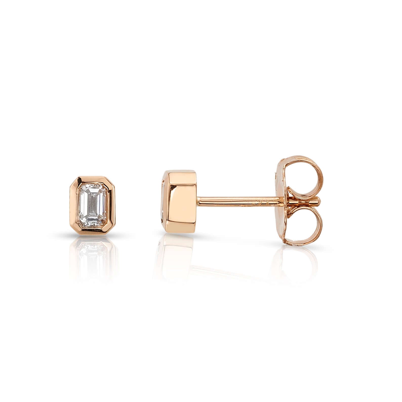 SINGLE STONE SIERRA STUDS | Earrings featuring Approximately 0.18ctw G-I/VS emerald cut diamonds bezel set in handcrafted stud earrings.