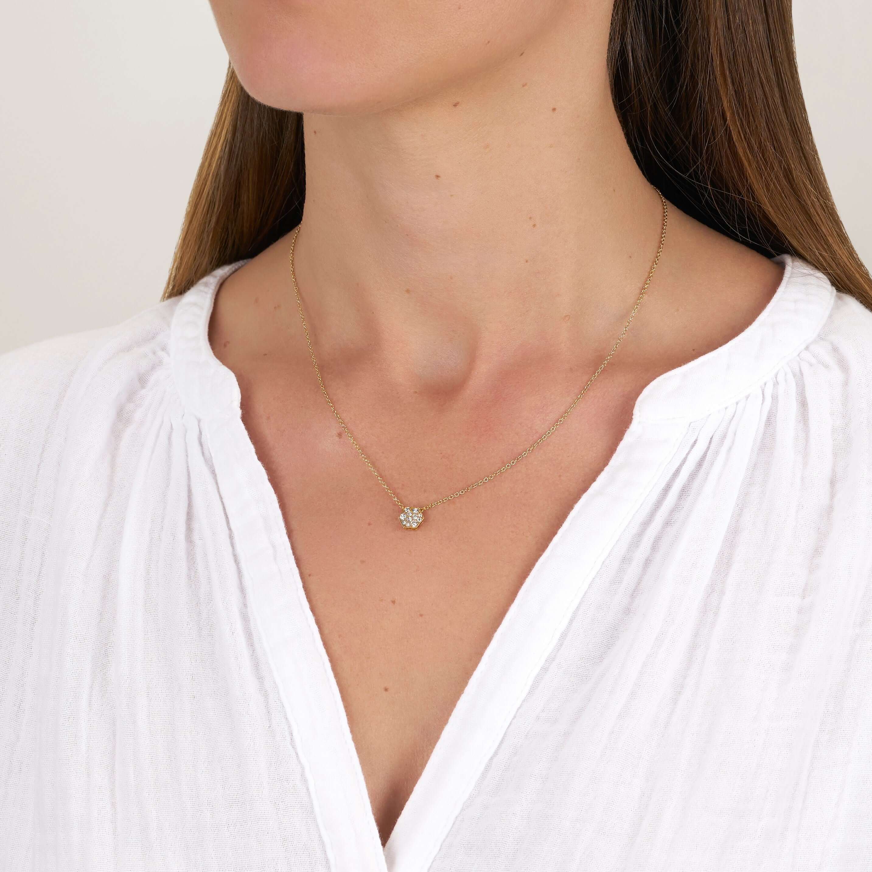 SINGLE STONE HEXAGONAL COBBLESTONE PENDANT NECKLACE featuring Approximately 0.30ctw varying old cut and round brilliant cut diamonds set in a handcrafted 18K yellow gold pendant on an 18K yellow gold chain. Available in an oxidized or polished finish. Nec