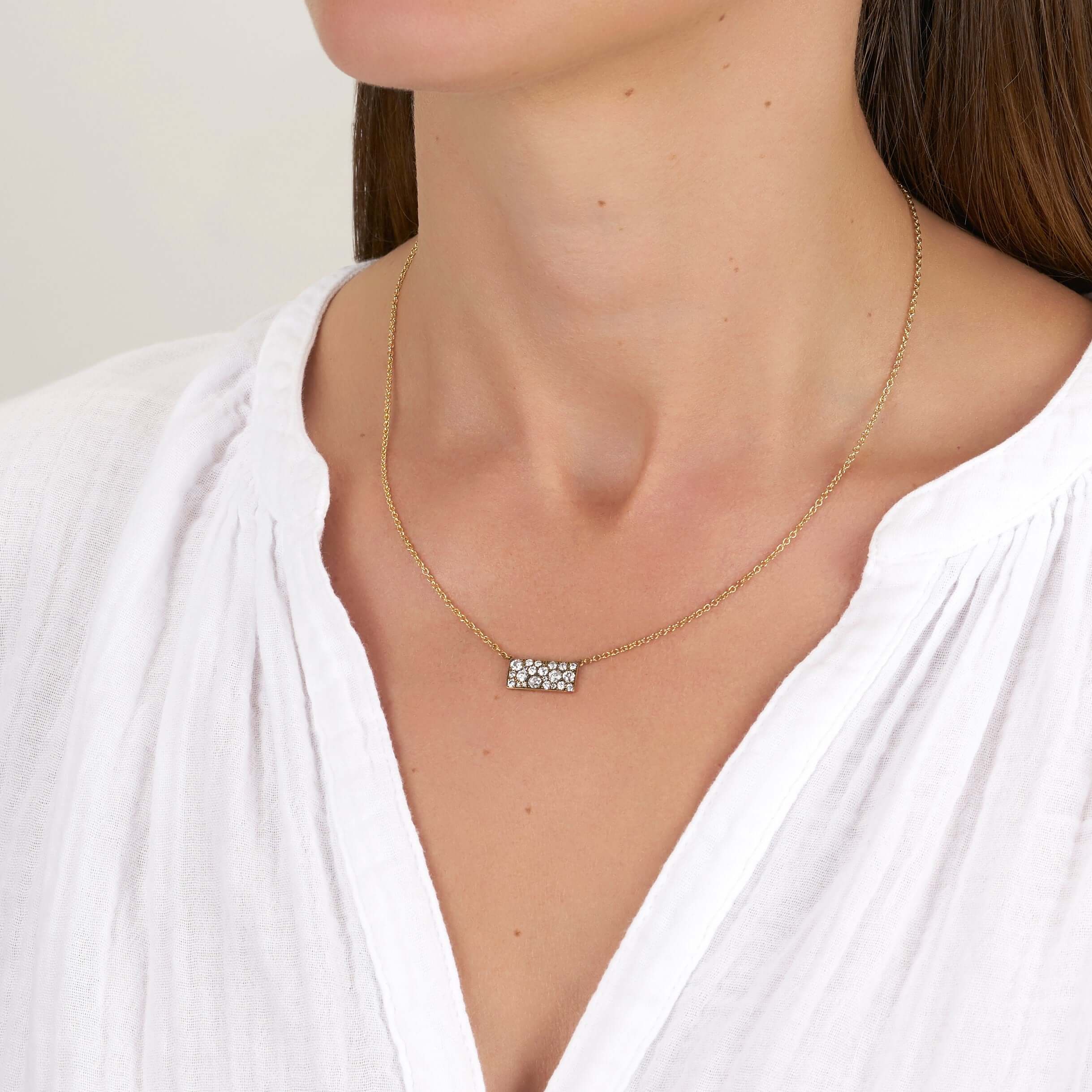 SINGLE STONE MILO COBBLESTONE PENDANT NECKLACE featuring Approximately 0.95ctw varying old cut and round brilliant cut diamonds set in a handcrafted 18K yellow gold pendant. Necklace measures 18". Price may vary according to total diamond weight. Availabl