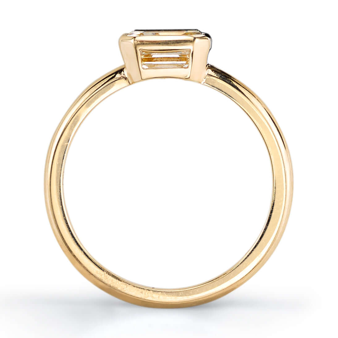 SINGLE STONE LEAH RING featuring 1.03ctw J/VVS1 HRD certified emerald cut diamond set in a handcrafted 18K yellow gold mounting.