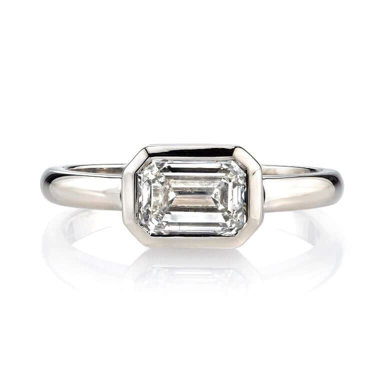 SINGLE STONE MARNI RING featuring 1.20ct L/VVS1 GIA certified emerald cut diamond set in a handcrafted 18K champagne gold mounting.