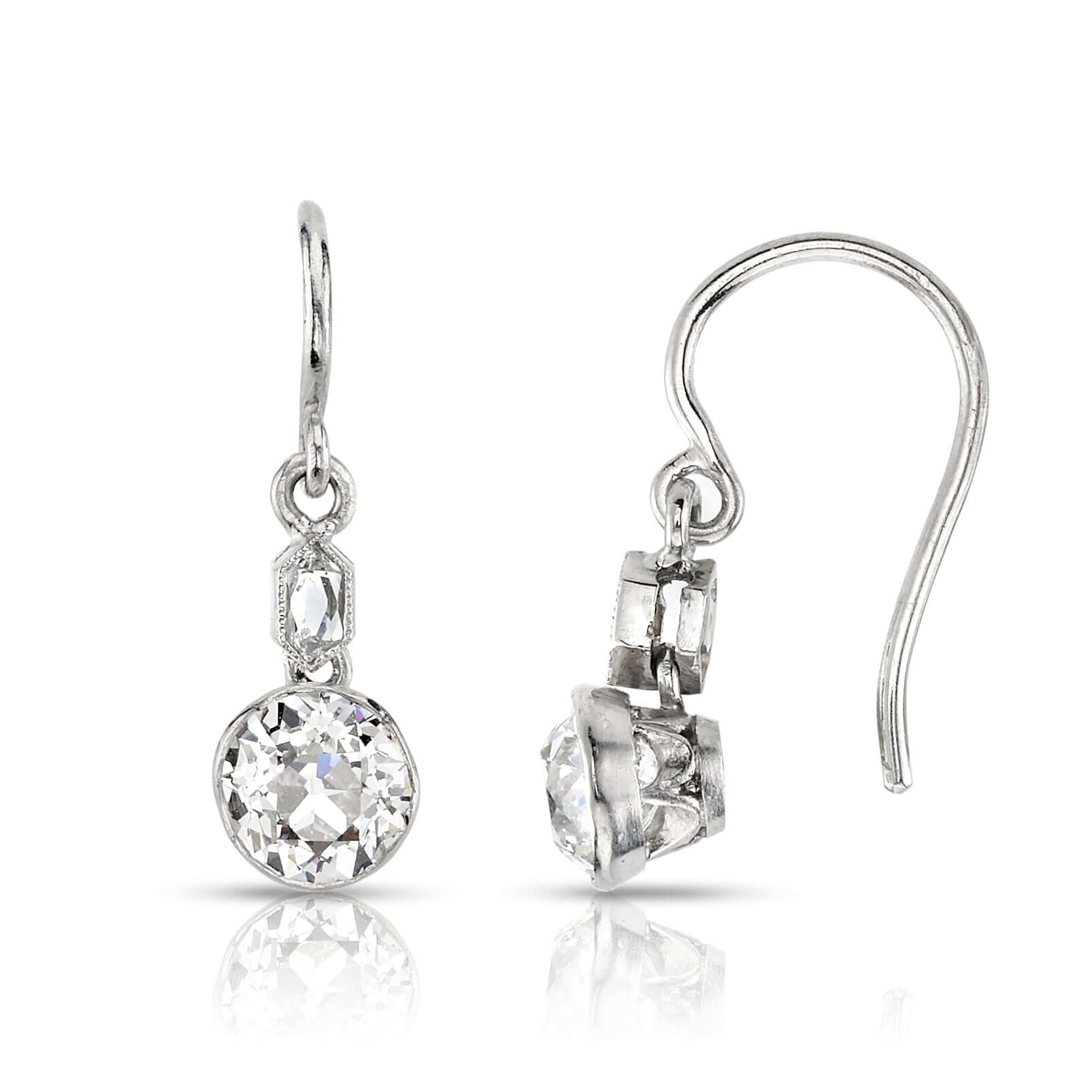 SINGLE STONE DUPRIE DROPS | Earrings featuring 1.21ctw G-H/VS2-SI1 antique old mine cut diamonds with 0.10ctw French cut accent diamonds bezel set in handcrafted platinum double drop earrings.