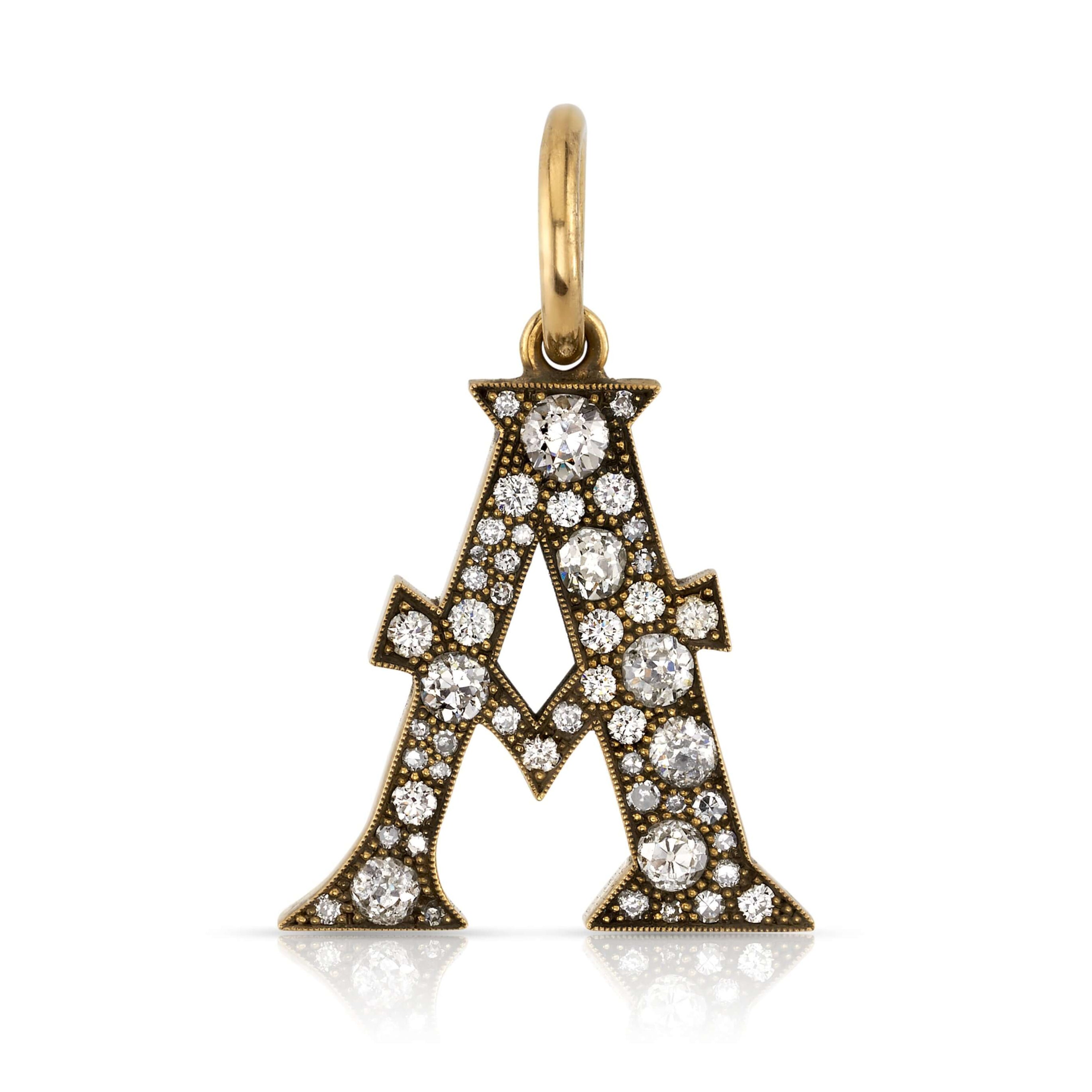SINGLE STONE LARGE COBBLESTONE LETTERS PENDANT featuring Approximately 0.95ctw-2.75ctw varying old cut and round brilliant cut diamonds set in a handcrafted 18K yellow gold letter pendant. Letters are approximately 1" tall. Available in an oxidized or pol