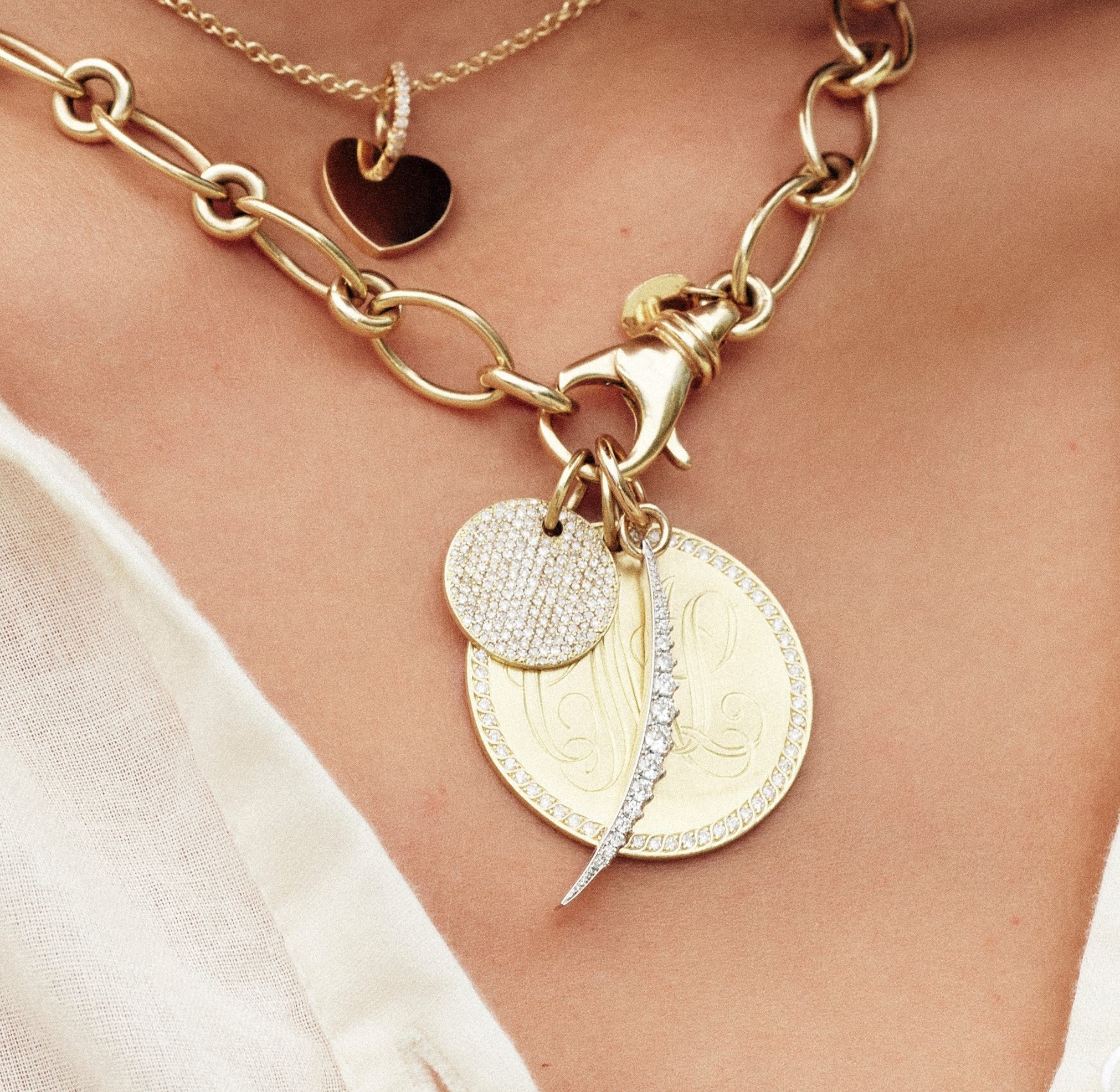 SINGLE STONE COMPLETE PAVE ROUND DISC PENDANT featuring Old European cut diamonds pave set in a handcrafted 18K yellow gold engravable round pendant. Ctw varies by disc size. Option of monogrammed engraving of up to three letters. Please contact us to inq