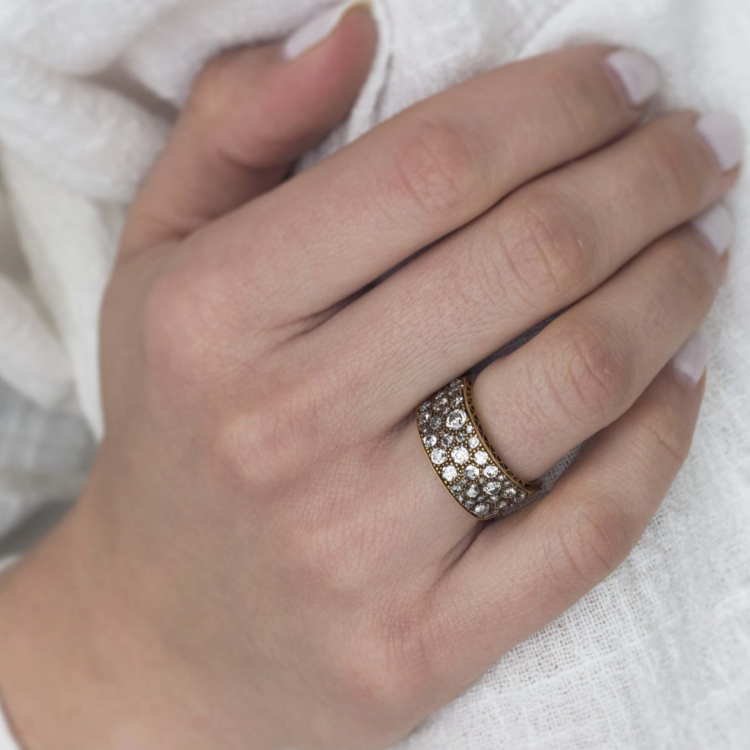 SINGLE STONE COBBLESTONE BAND BAND | Approximately 2.25ctw varying old cut and round brilliant cut diamonds set in a handcrafted 18K yellow gold band. Approximate band width 8.9mm. *Cobblestone pattern may vary from piece to piece Please inquire for addit