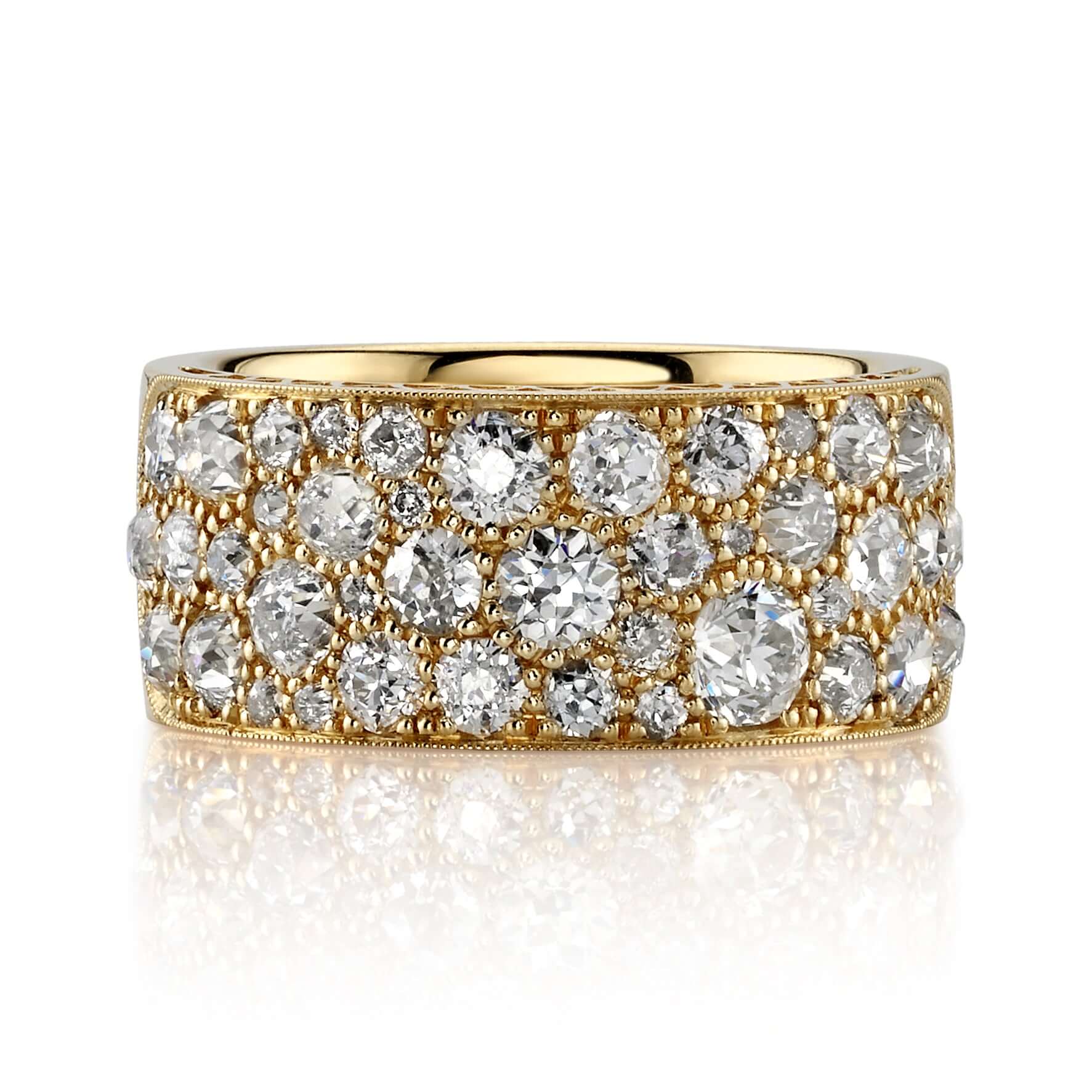 SINGLE STONE COBBLESTONE BAND BAND | Approximately 2.25ctw varying old cut and round brilliant cut diamonds set in a handcrafted 18K yellow gold band. Approximate band width 8.9mm. *Cobblestone pattern may vary from piece to piece Please inquire for addit