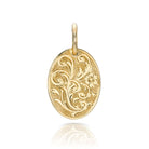 SINGLE STONE 20mm FLORAL ENGRAVED OVAL PENDANT PENDANT featuring Handcrafted 20mm floral engraved oval shaped pendant in 18K yellow gold. Price does not include chain.