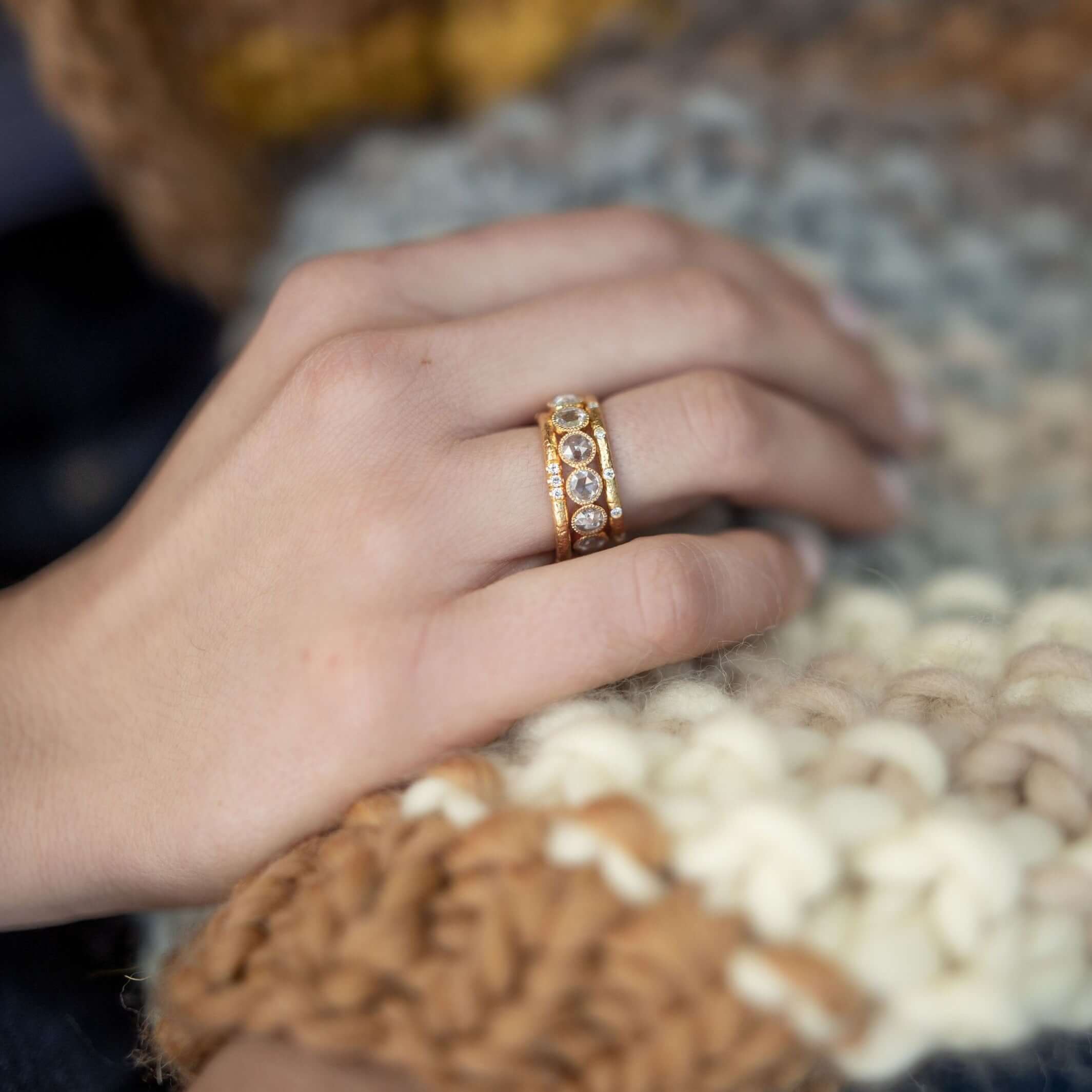 SINGLE STONE YORK BAND | Approximately 0.10ctw G-H/VS old European cut diamonds set in a handcrafted 22K yellow gold hammer finished band. Approximate band with 2mm. Please inquire for additional customization.