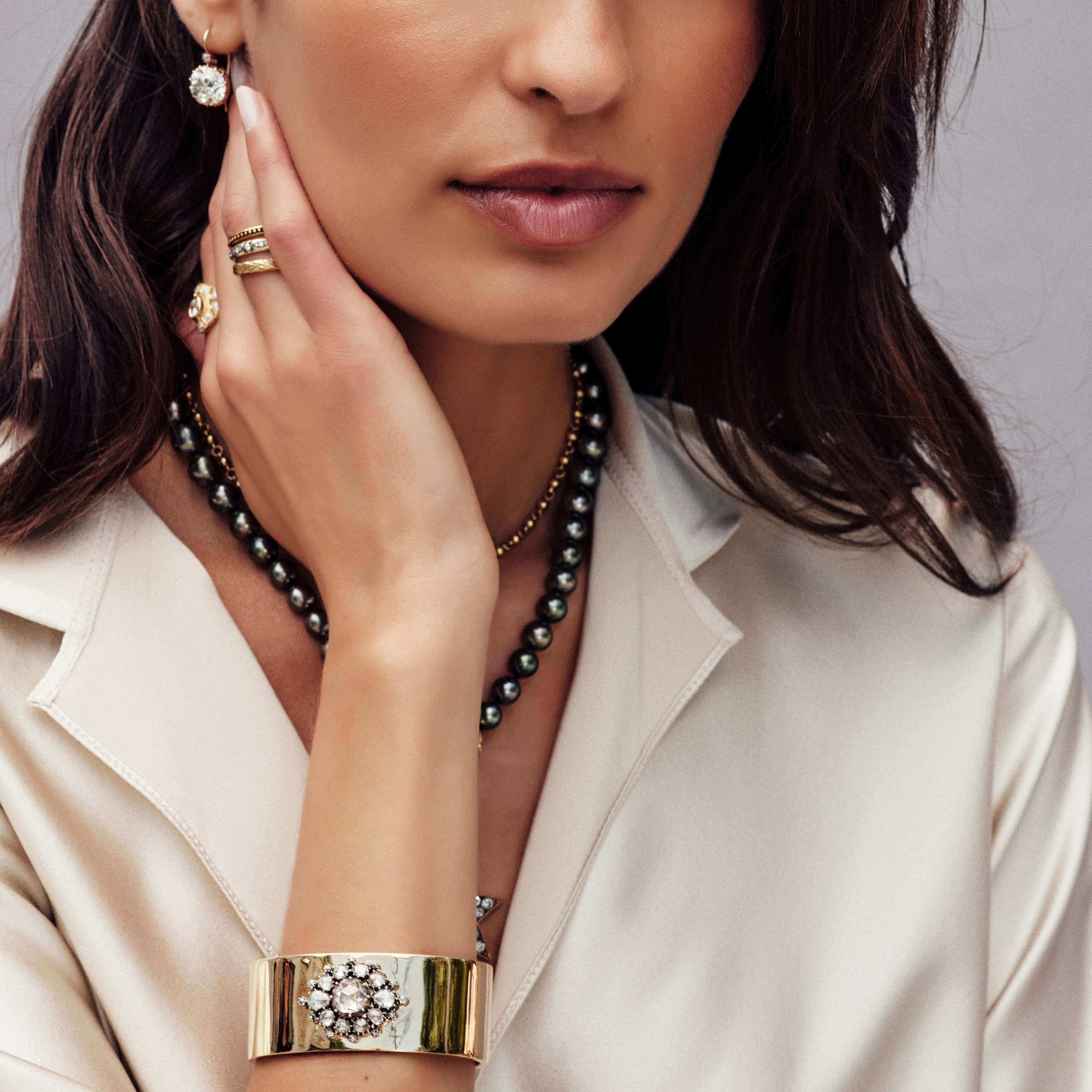 Single Stone ASHLYN CUFF featuring 2.50ct Rose cut diamond with 2.25ctw Rose cut diamond surround set in an oxidized silver mounting on a handcrafted 18k yellow gold cuff.