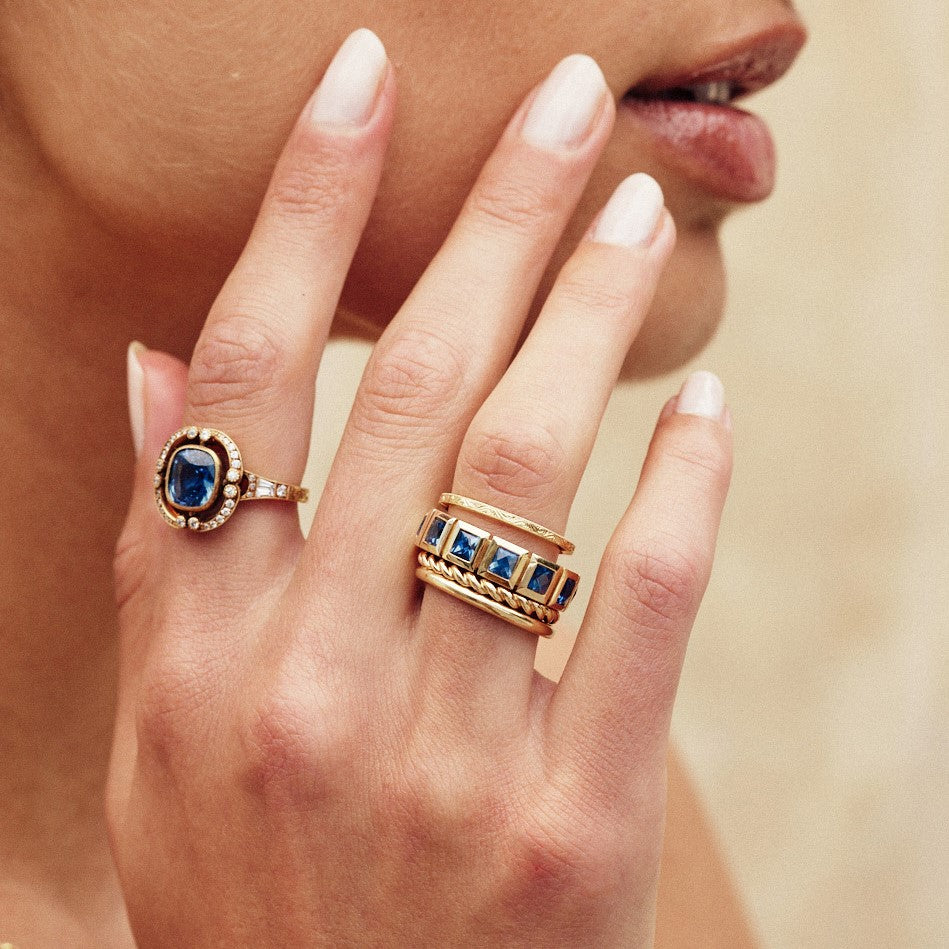 SINGLE STONE LARGE KARINA WITH GEMSTONES BAND | Approximately 2.75ctw-3.00ctw square French cut gemstones bezel set in a handcrafted 18K yellow gold eternity band. Available with rubies, sapphires or emeralds. Approximate band width 5.5mm. Please inquire