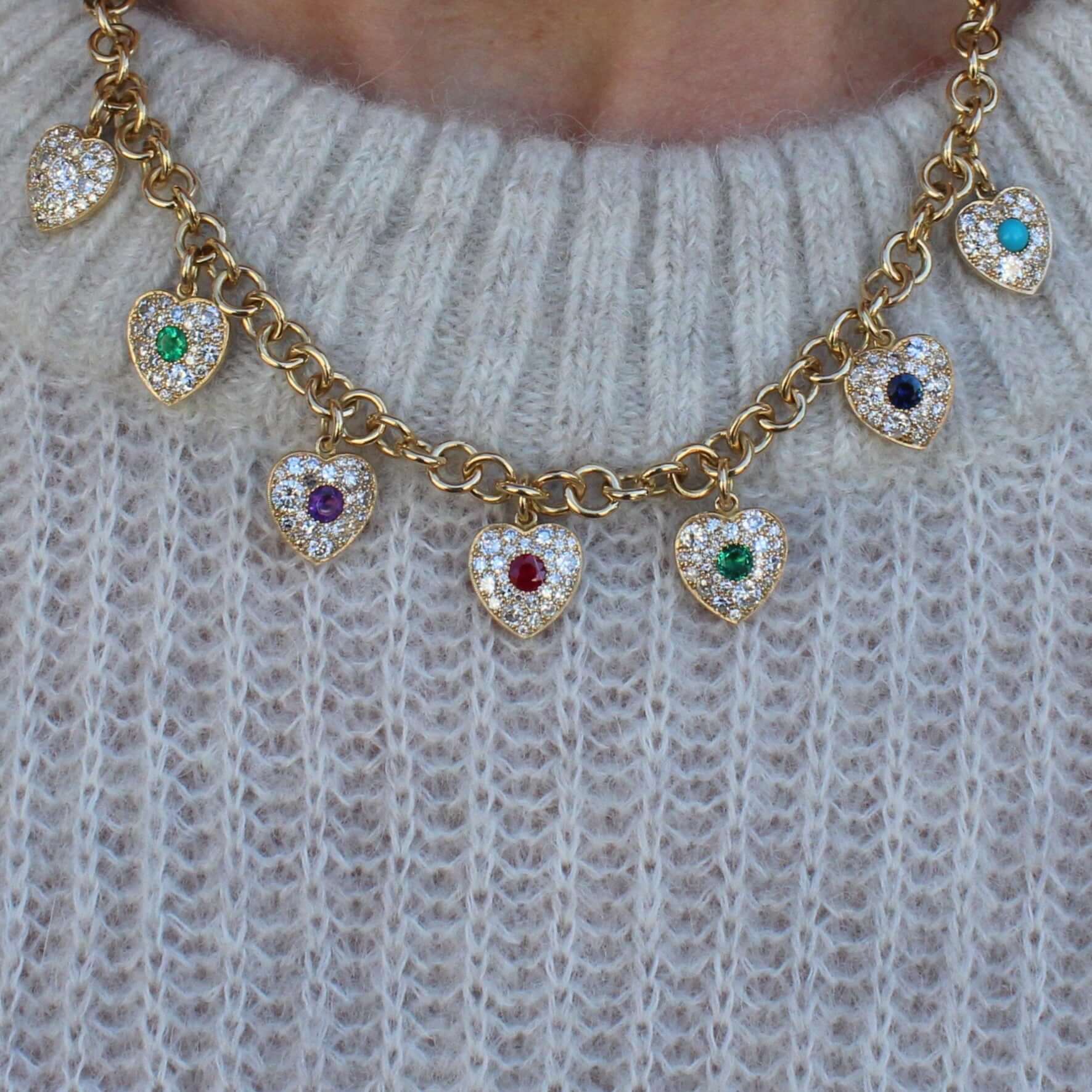 SINGLE STONE DEAREST NECKLACE featuring This colorful Victorian inspired charm necklace showcases a gallery of gemstones holding a hidden term of endearment. Within each heart, various gemstones are arranged in order (diamond, emerald, amethyst, ruby, eme