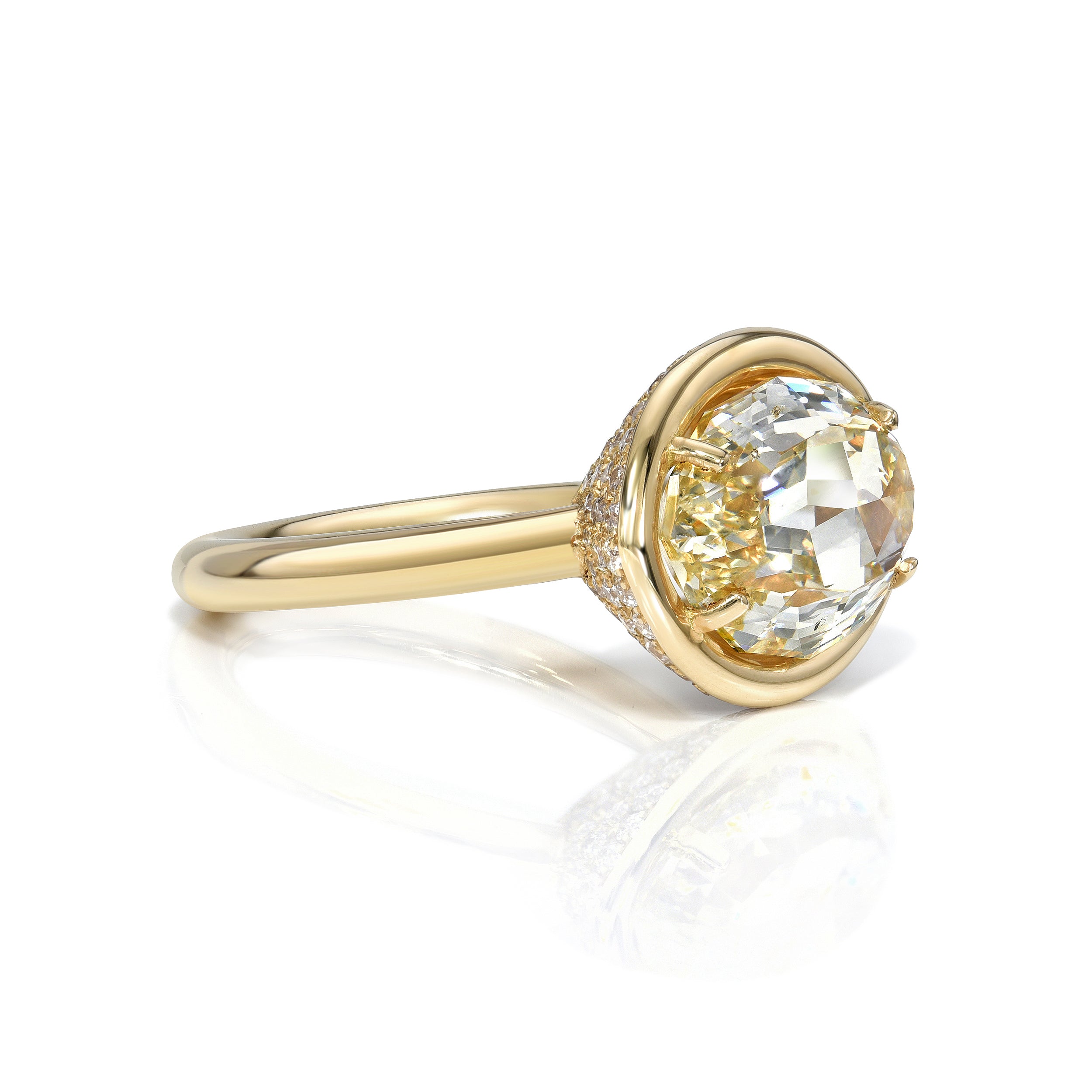 SINGLE STONE DEVI RING featuring 5.21ct Fancy Lt. Brownish Yellow/SI2 GIA certified oval cut diamond with 0.85ctw old European cut accent diamonds set in a handcrafted 18K yellow gold mounting.
