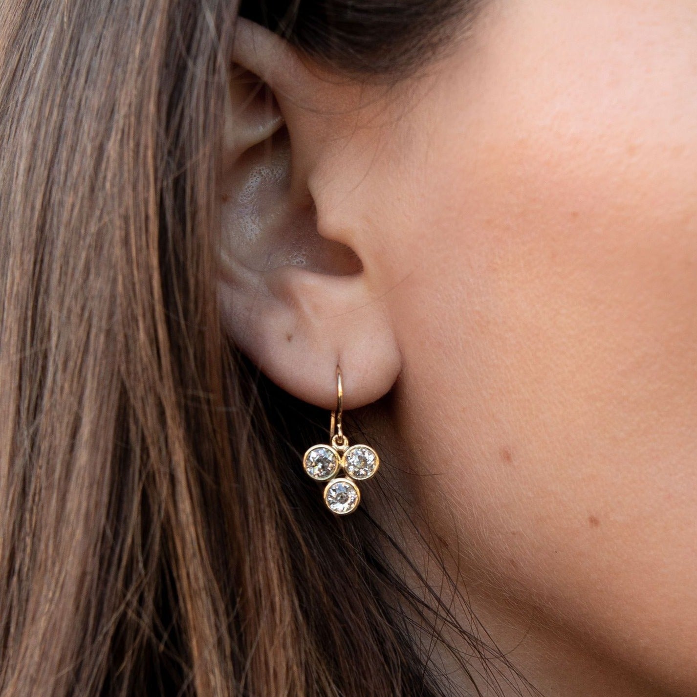 SINGLE STONE EBONY DROPS | Earrings featuring 2.09ctw J-K/VS-SI old European and antique old mine cut diamonds mounted in handcrafted 18K yellow gold drop earrings.