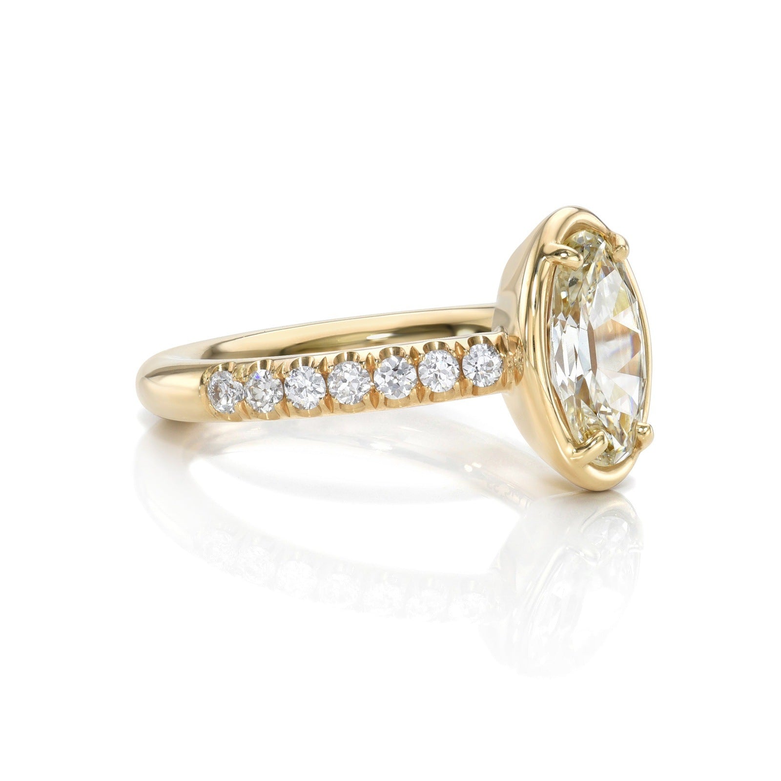 SINGLE STONE ELLA RING featuring 1.39ct L/VS2 GIA certified moval cut diamond with 0.35ctw old European cut accent diamonds prong set in a handcrafted 18K yellow gold mounting.