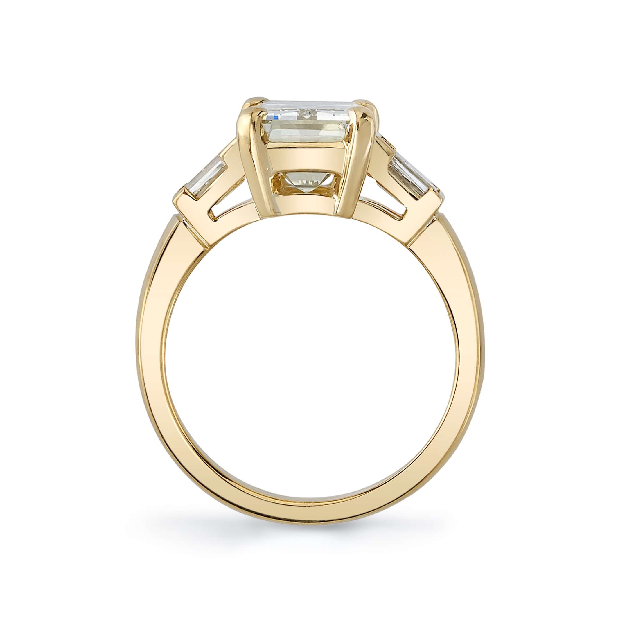 SINGLE STONE FAY RING featuring 3.30ct S-T/VVS2 GIA certified emerald cut diamond with 0.55ctw baguette cut accent diamonds prong set in a handcrafted 18K yellow gold setting.