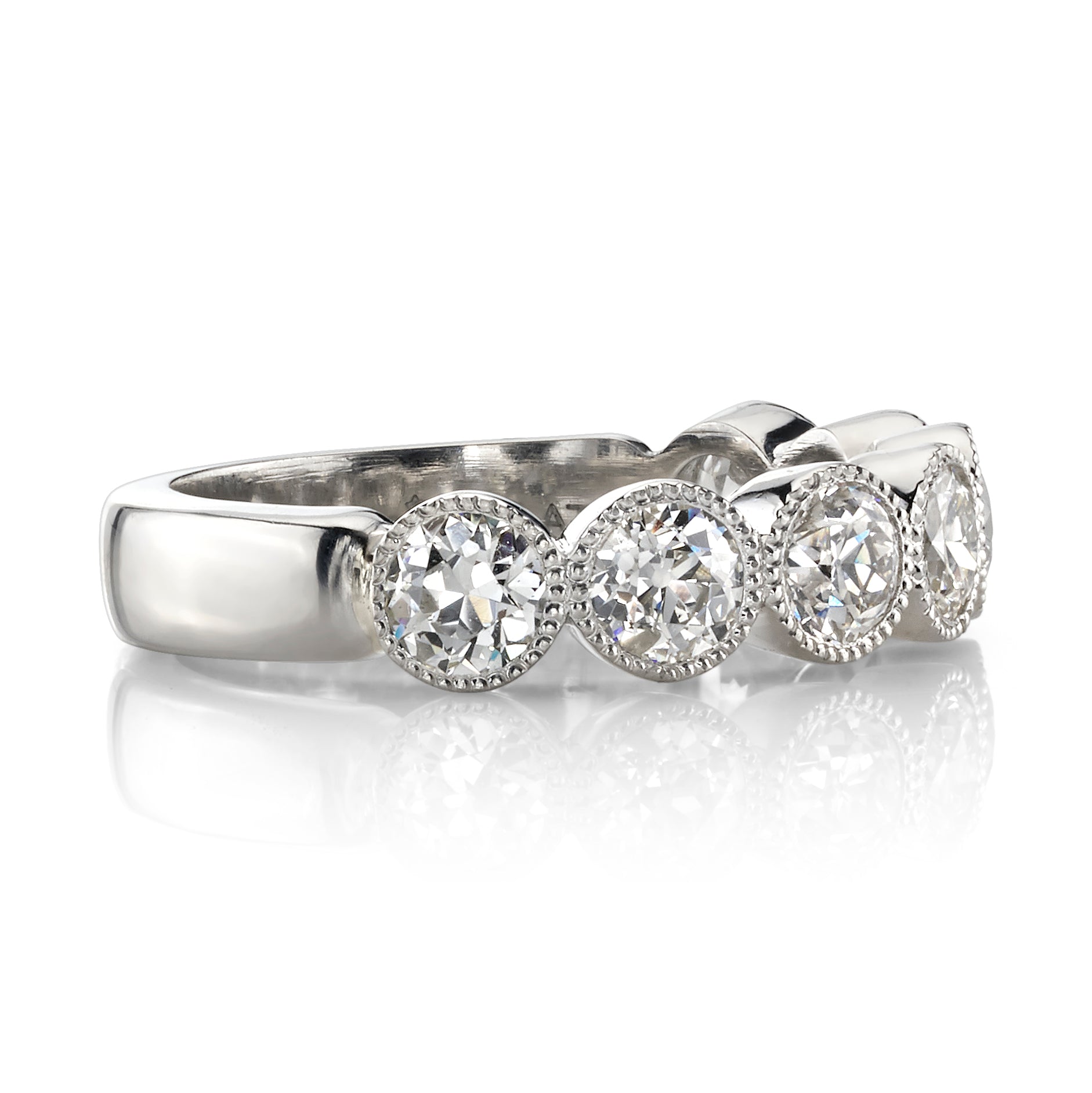 SINGLE STONE LARGE GABBY HALF BAND BAND | Approximately 1.50-1.70ctw old European cut diamonds set in a handcrafted bezel set half-eternity band. Approximate band width 4.8mm.