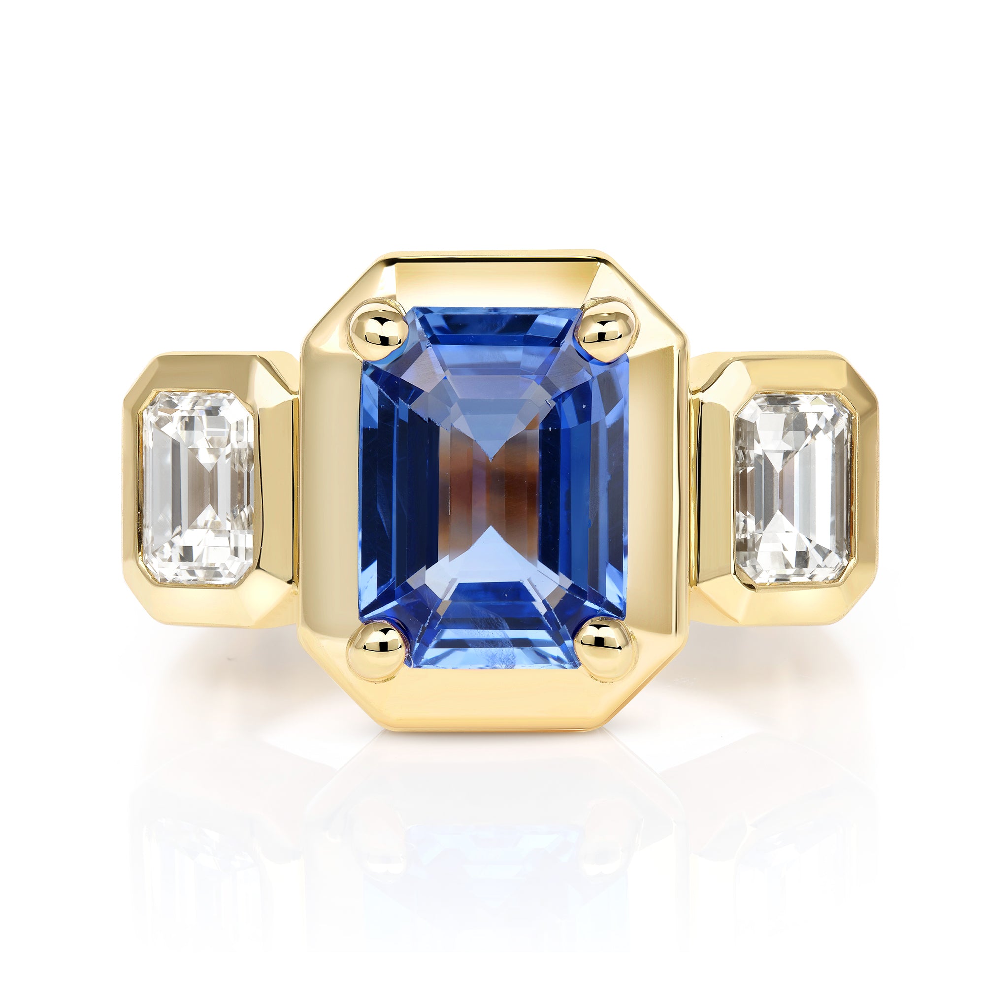 SINGLE STONE GLORIA RING featuring 2.90ct Sri Lankan GIA certified emerald cut blue sapphire with 1.00ctw GIA certified emerald cut diamonds prong set in a handcrafted 18K yellow gold mounting.