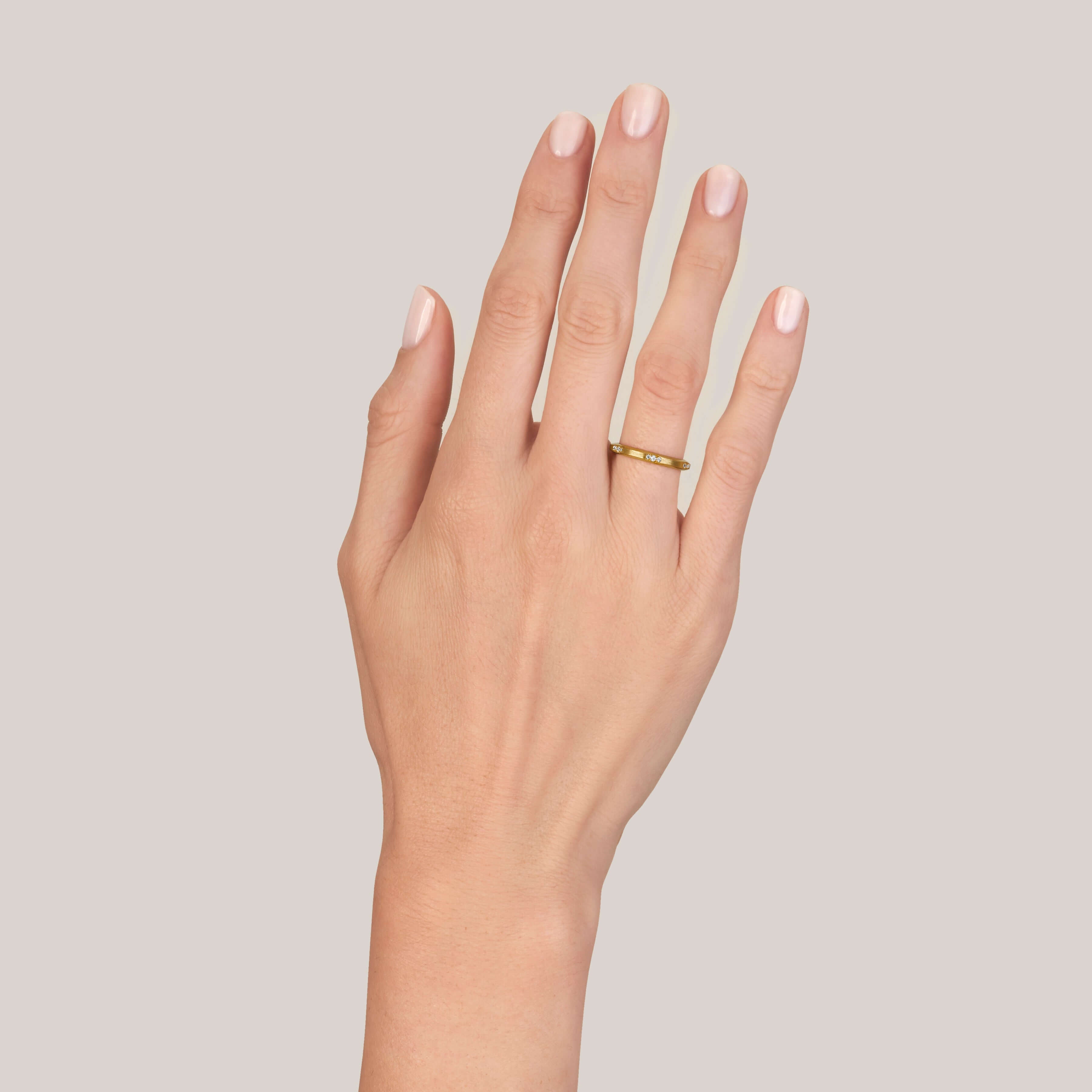 SINGLE STONE GROVER BAND | Approximately 0.15ctw G-H/VS old European cut diamonds set in a handcrafted satin finish eternity band. Approximate band width 2mm. Please inquire for additional customization.