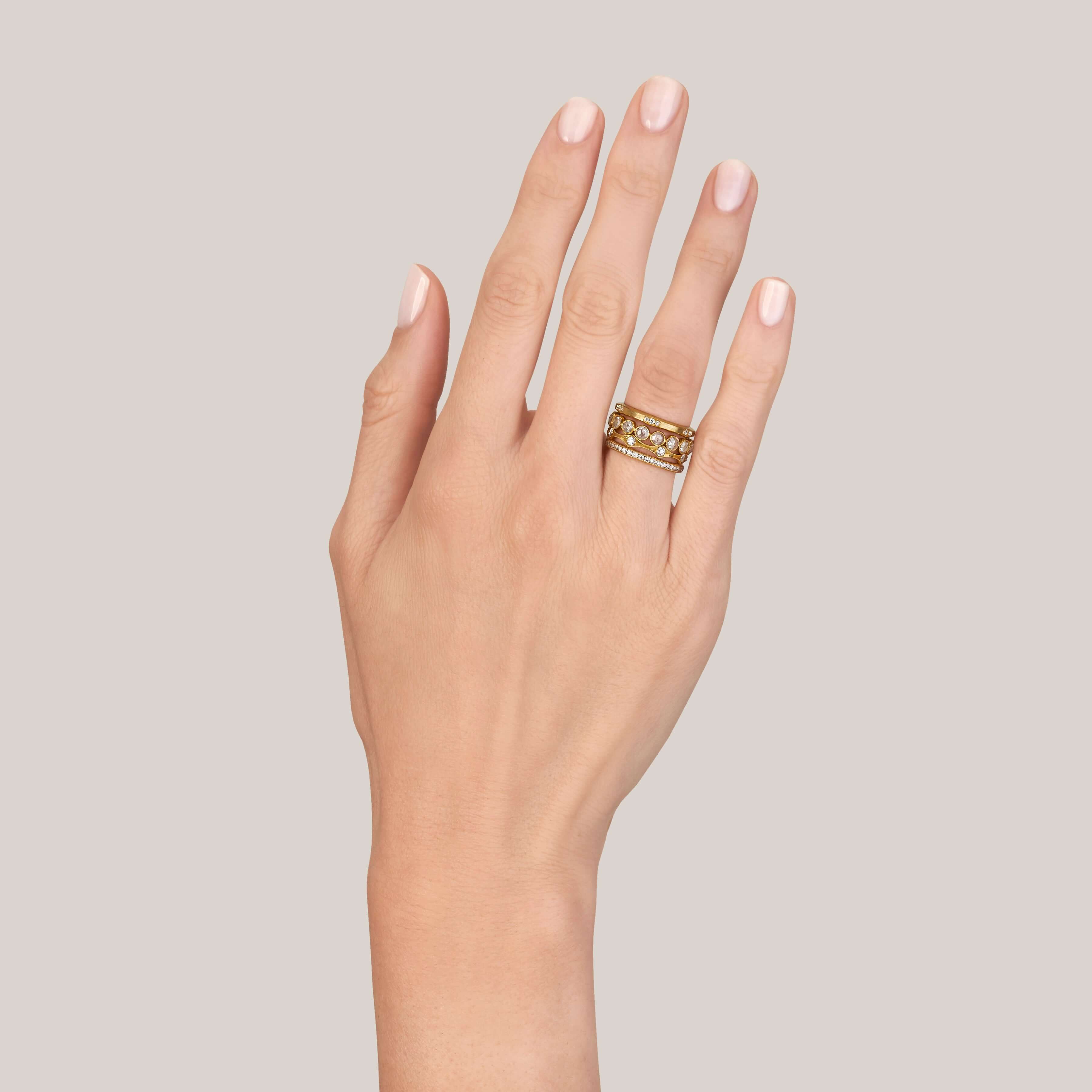 SINGLE STONE GROVER BAND | Approximately 0.15ctw G-H/VS old European cut diamonds set in a handcrafted satin finish eternity band. Approximate band width 2mm. Please inquire for additional customization.