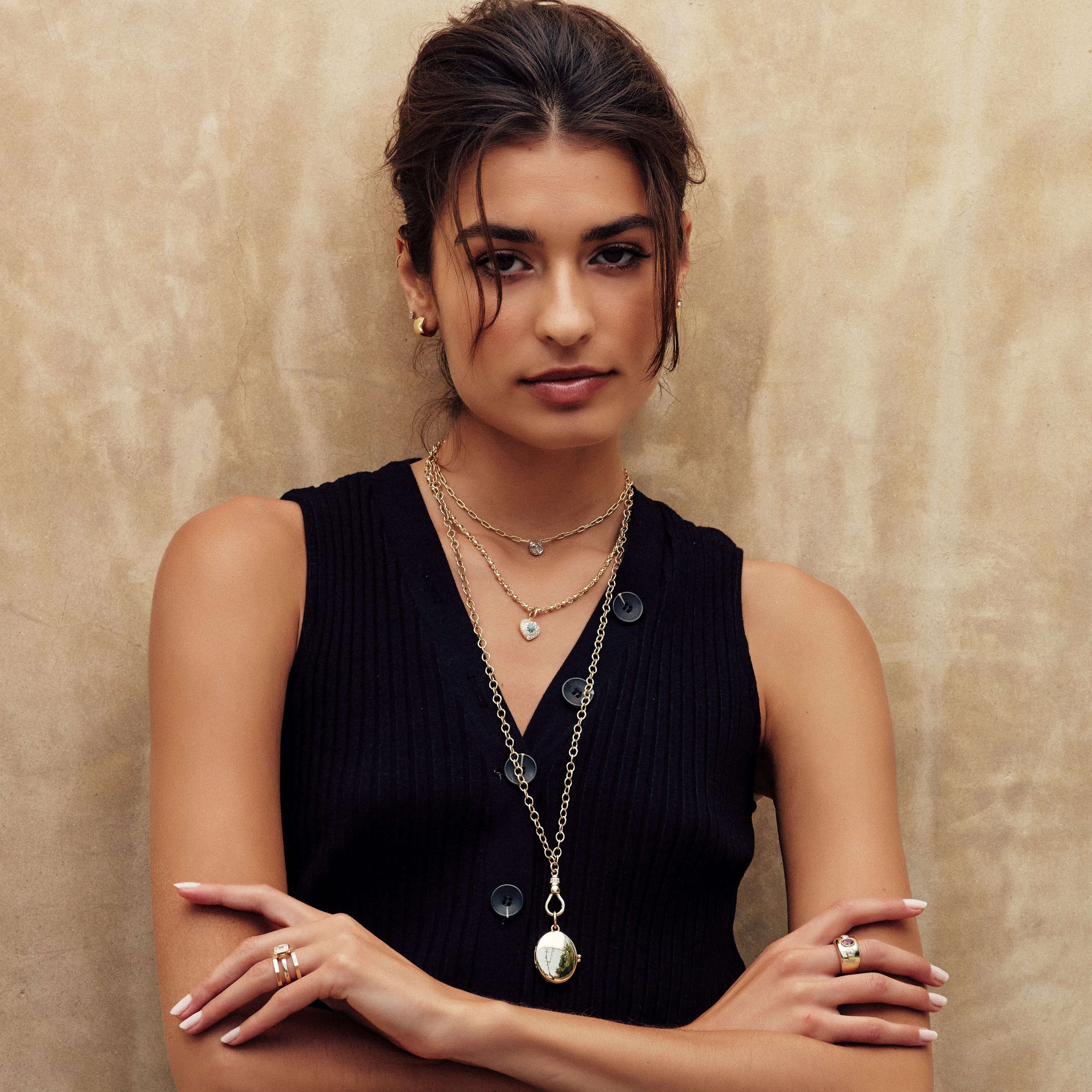 SINGLE STONE HARMONY LOCKET PENDANT featuring Handcrafted 18K yellow gold clasp and hinge locket - measures 34mm x 27mm. Locket can be monogrammed or engraved. Contact us for additional inquiries or customization. Price does not include chain.