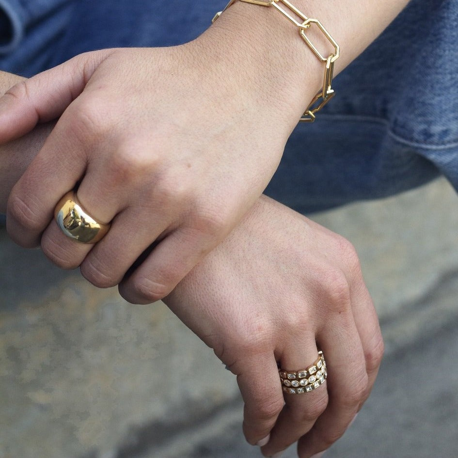 SINGLE STONE SIENNA BAND | Polished and domed 18K yellow gold cigar band measuring approximately 13mm across at its widest point. Please inquire for additional customization.