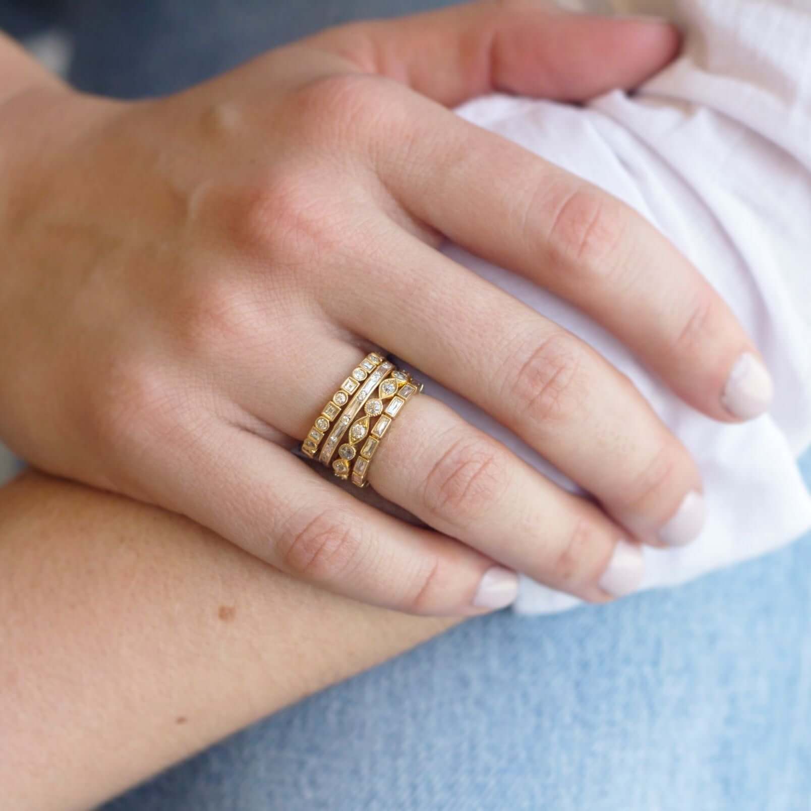 SINGLE STONE SMALL JULIA BAND | Approximately 0.75ctw G-H/VS French cut diamonds bezel set in a handcrafted eternity band. Approximate band with 2.1mm. Please inquire for additional customization.