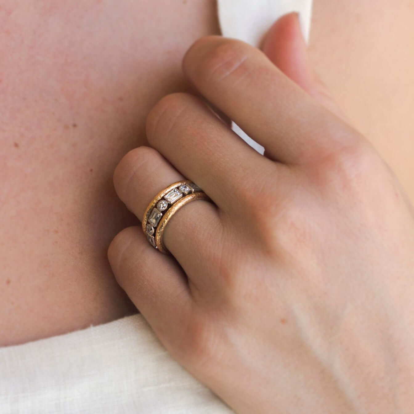 SINGLE STONE MELISSA BAND | Approximately 2.00ctw G-H/VS old European and French cut diamonds bezel set in a handcrafted eternity band. Approximate band width 3.4mm, Please inquire for additional customization.