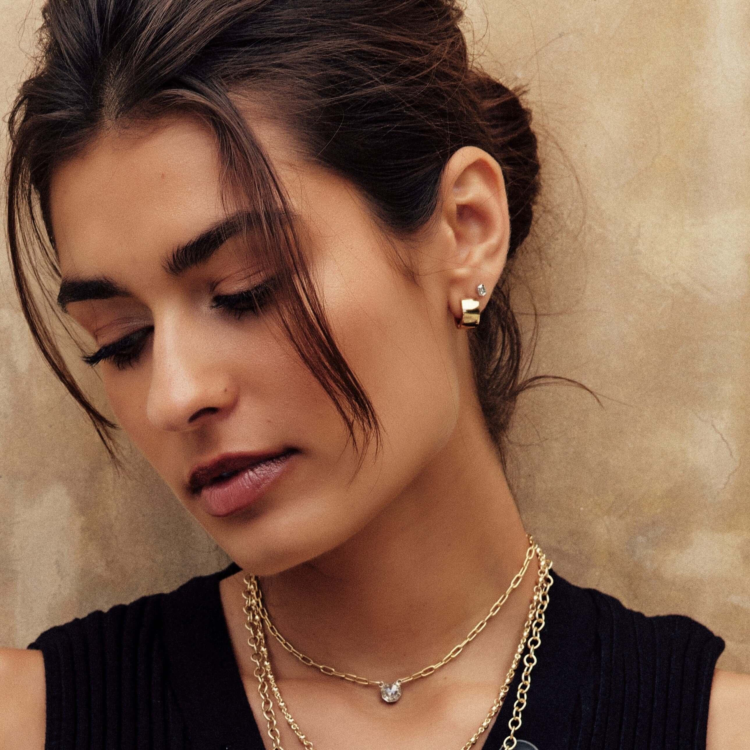 SINGLE STONE JENNI HUGGIES | Earrings featuring Handcrafted high polished 18K yellow gold huggie hoop earrings.