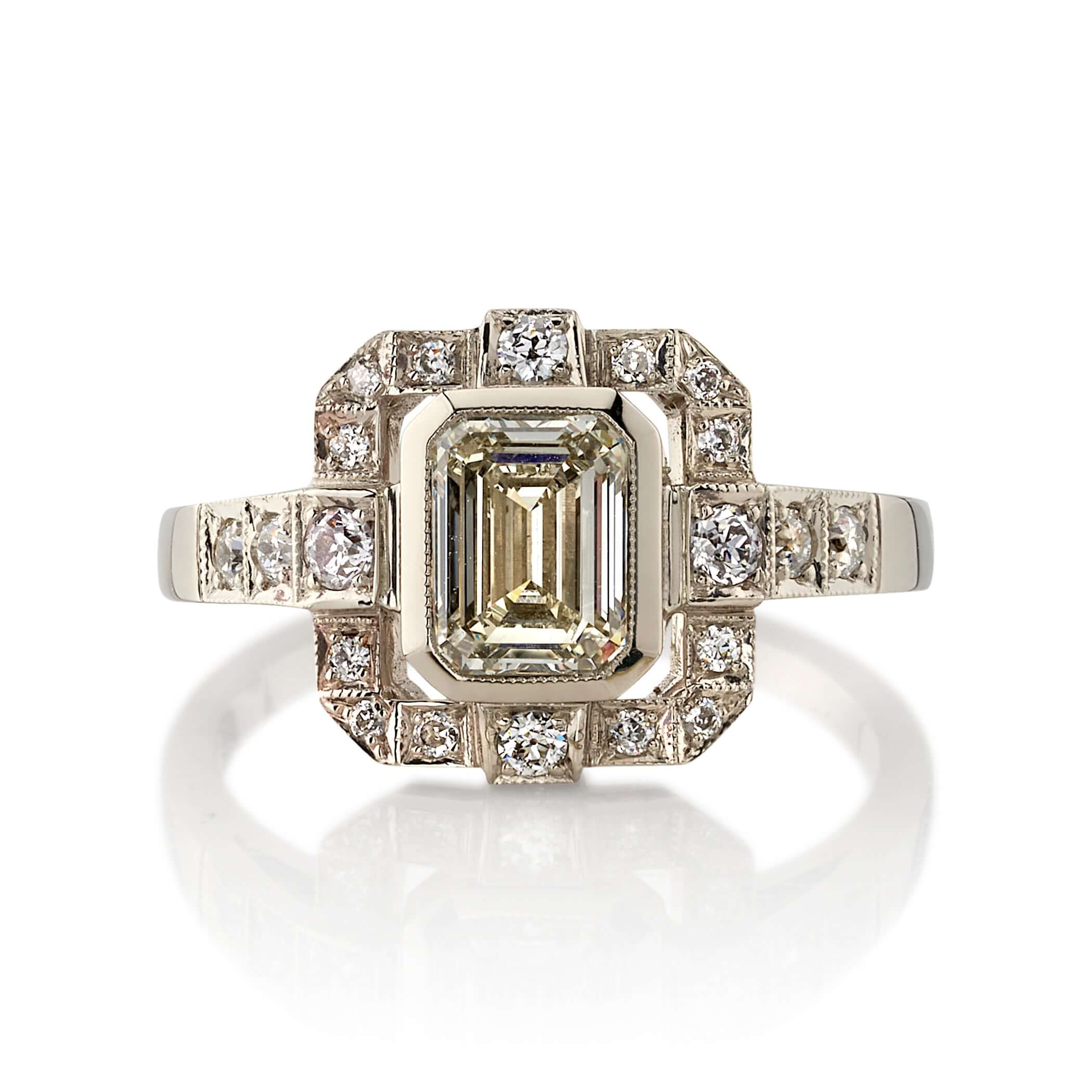SINGLE STONE KATIE RING featuring 1.01ct N/VS2 GIA certified emerald cut diamond with 0.34ctw old European cut accent diamonds set in a handcrafted 18K champagne white gold mounting.