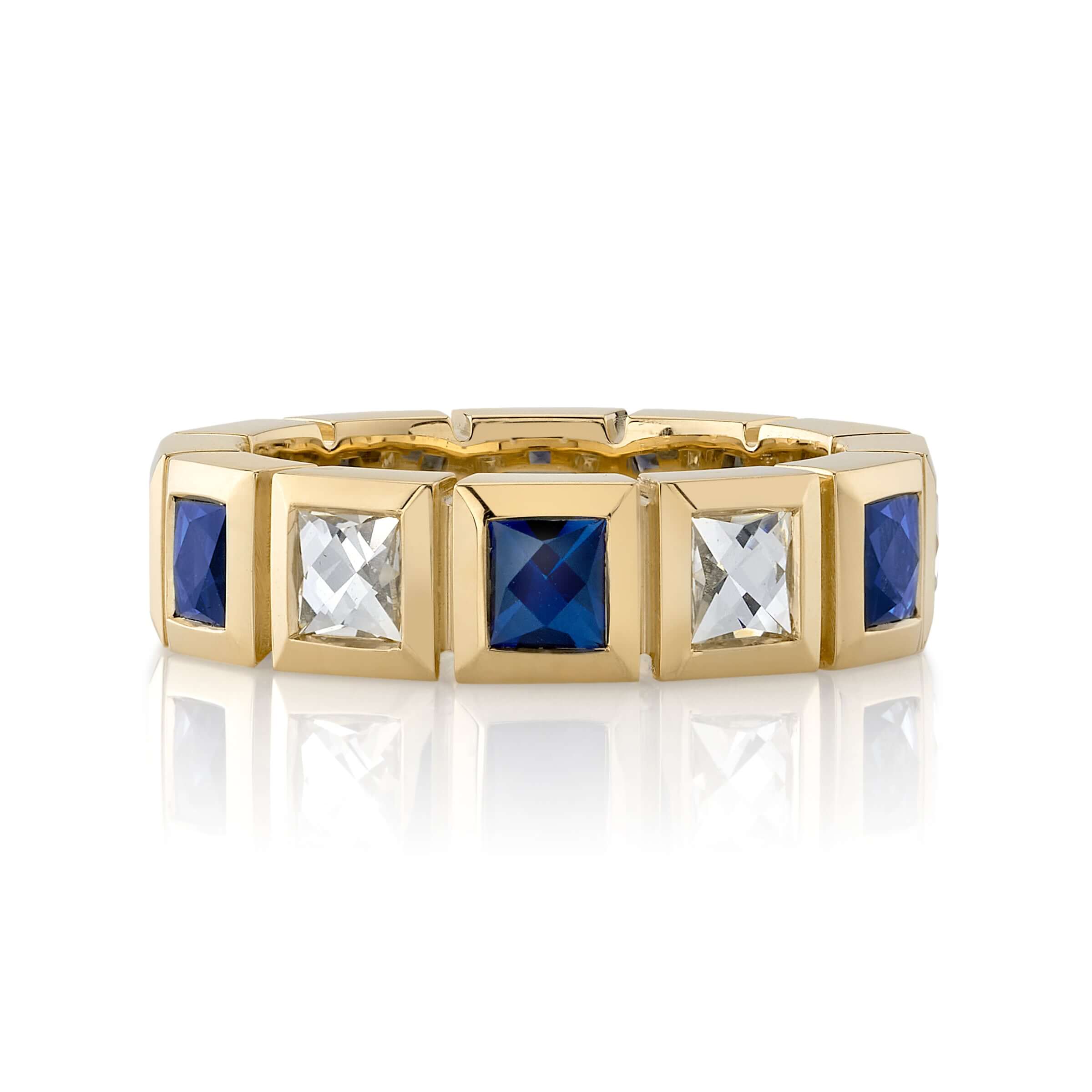SINGLE STONE LARGE KARINA WITH DIAMONDS AND GEMSTONES BAND | Approximately 1.30ctw H-I/VS French cut diamonds alongside 1.10ctw alternating French cut gemstones bezel set in a handcrafted 18K yellow gold eternity band. Approximate band width 5.5mm. *Stone