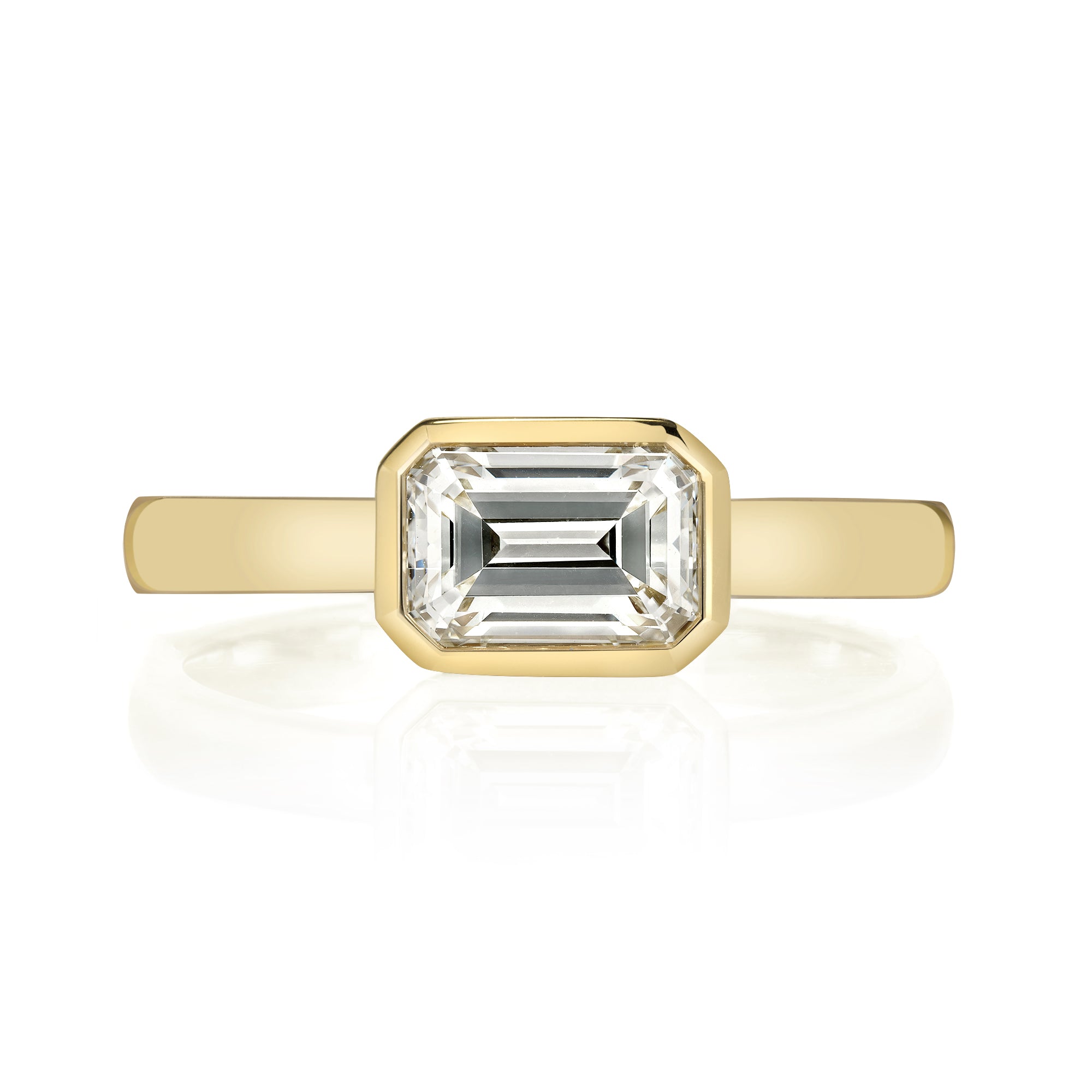 SINGLE STONE LEAH RING featuring 1.04ct K/VS2 GIA certified emerald cut diamond bezel set in a handcrafted 18K yellow gold mounting,