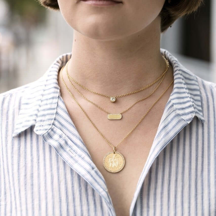 SINGLE STONE MILO NECKLACE featuring Vintage inspired yellow gold bar necklace. Necklace measures 17". Make it personal! Price includes monogrammed engraving of up to three letters in any of the styles shown above - please be sure to specify before placin
