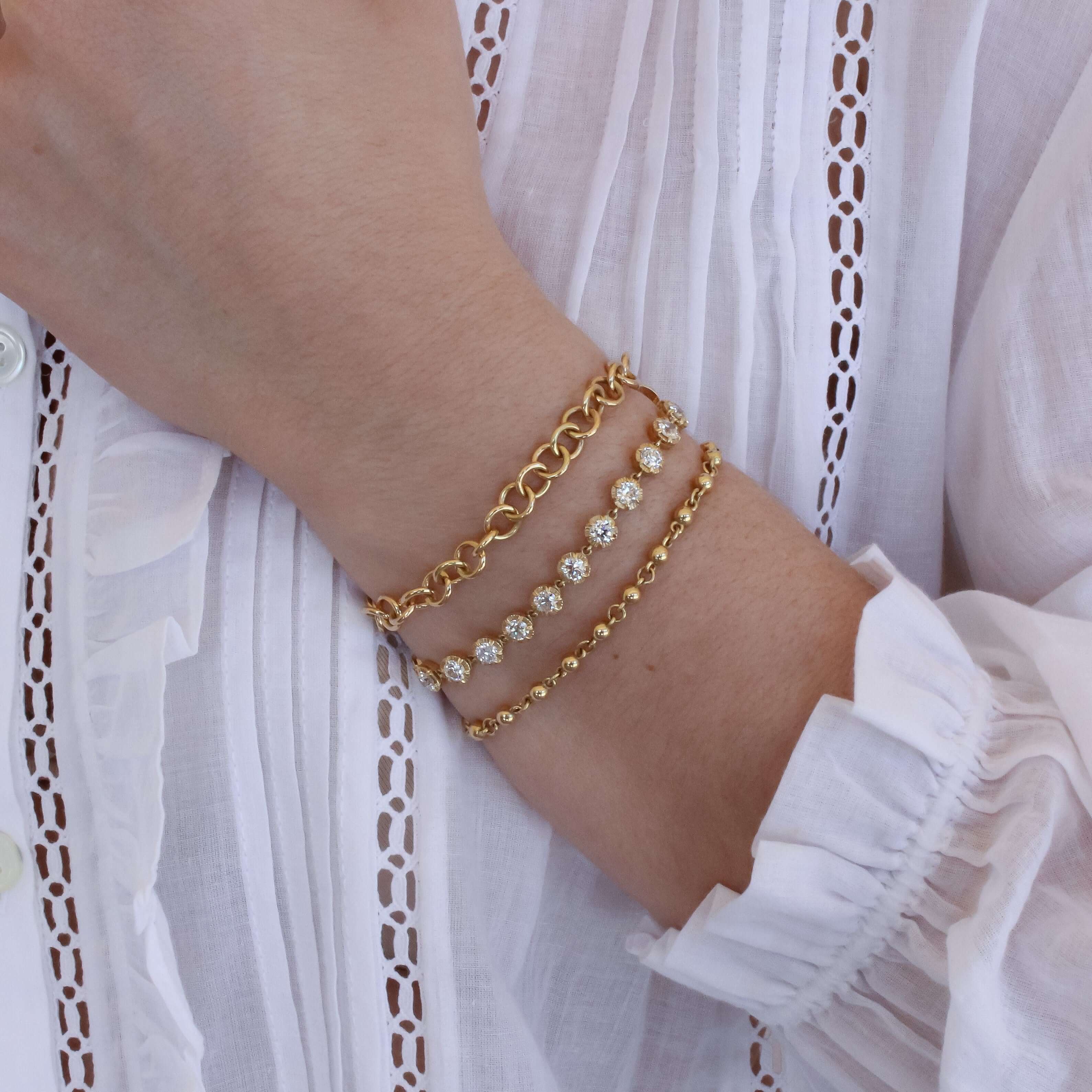 SINGLE STONE MINI CLUB BRACELET featuring Handcrafted 18K yellow gold small link bracelet. Charms sold separately. Bracelet measures 7.5". Please inquire for additional customization.