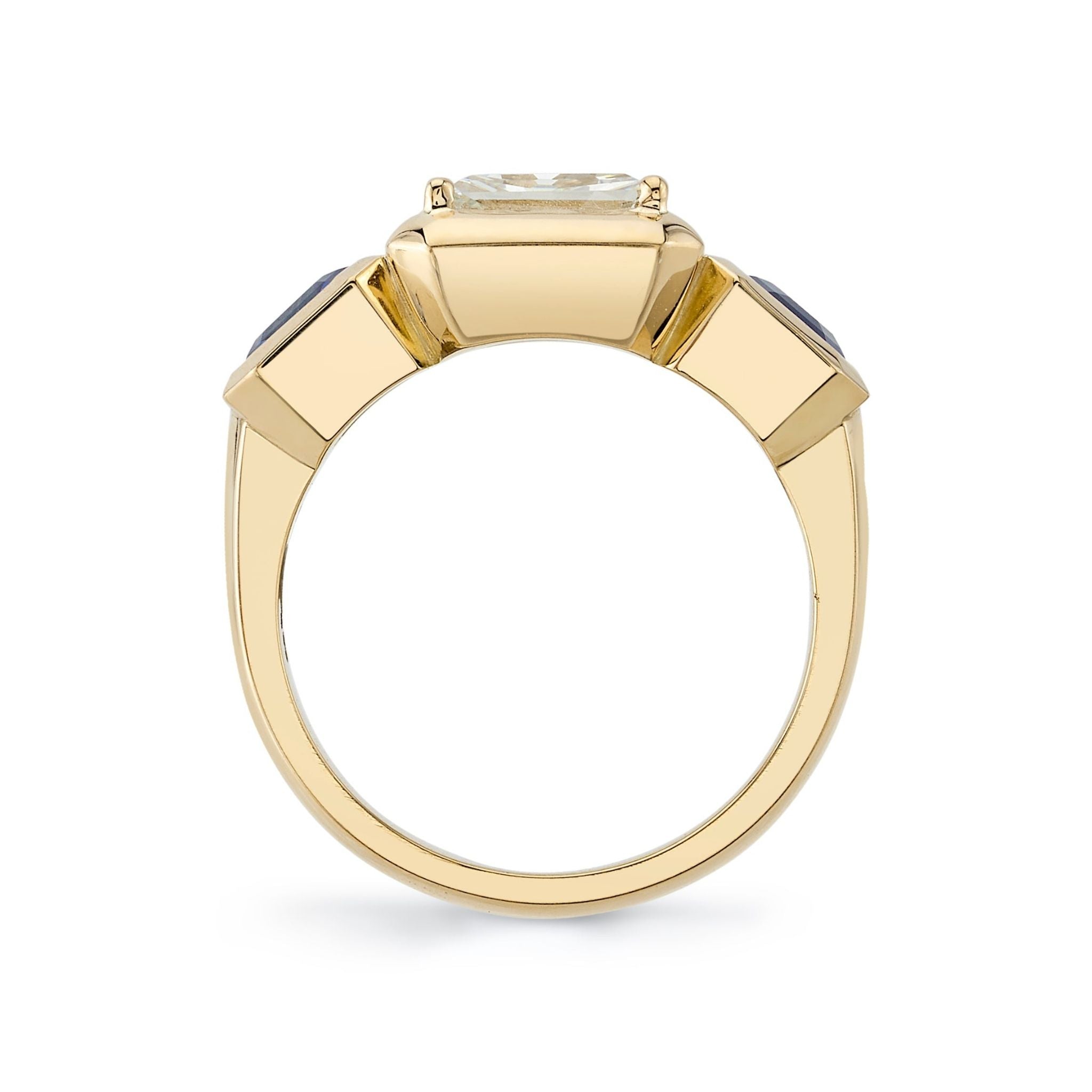 SINGLE STONE GLORIA RING featuring 1.77ct K/VS1 GIA certified rectangular mixed cut diamond with 1.65ctw blue sapphire accent stones set in a handcrafted 18K yellow gold mounting.