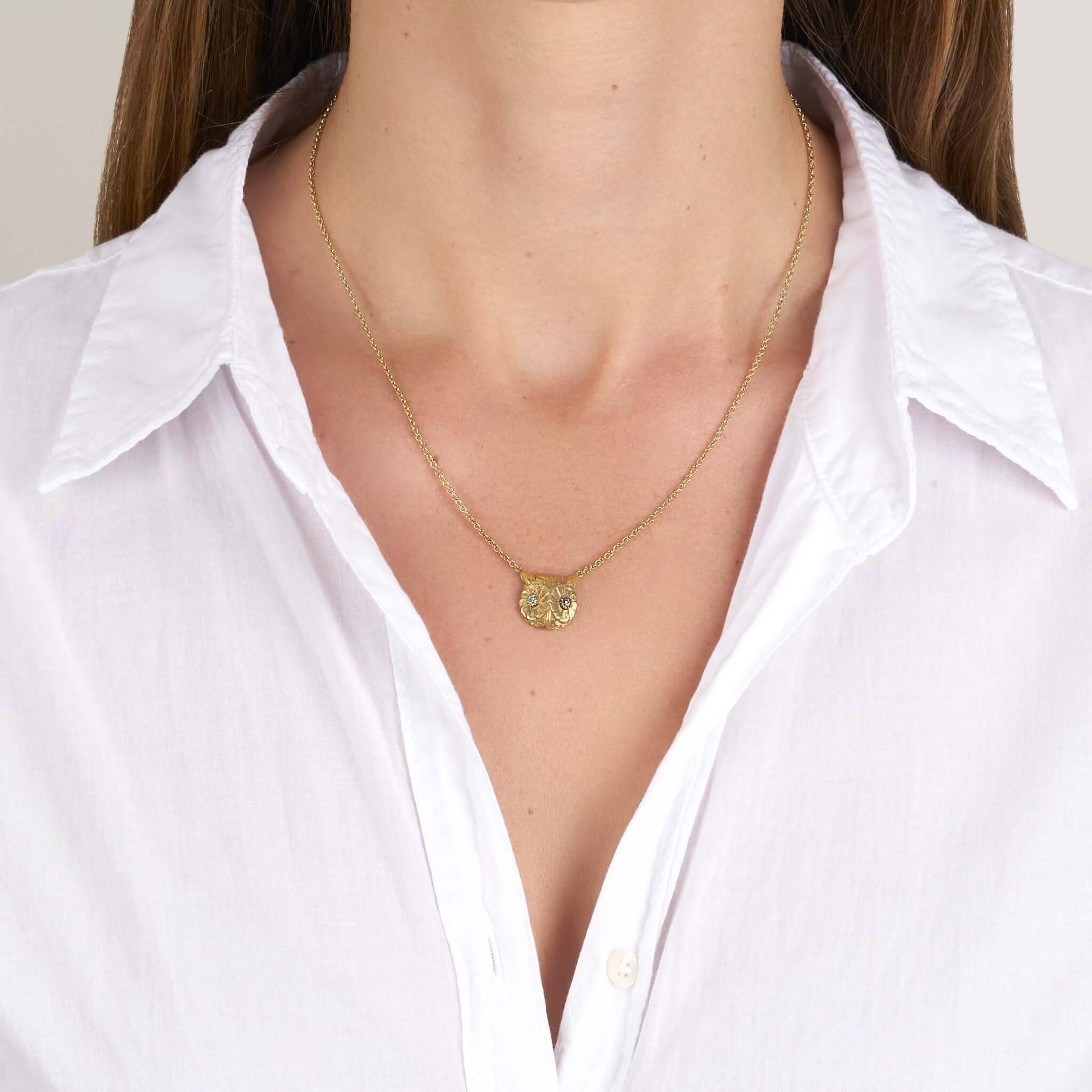 SINGLE STONE OWL PENDANT NECKLACE featuring 0.11ctw G-H/VS old European cut diamonds set in a handcrafted 18K yellow gold owl pendant necklace. Available in a polished or oxidized finish. Necklace measures 16".