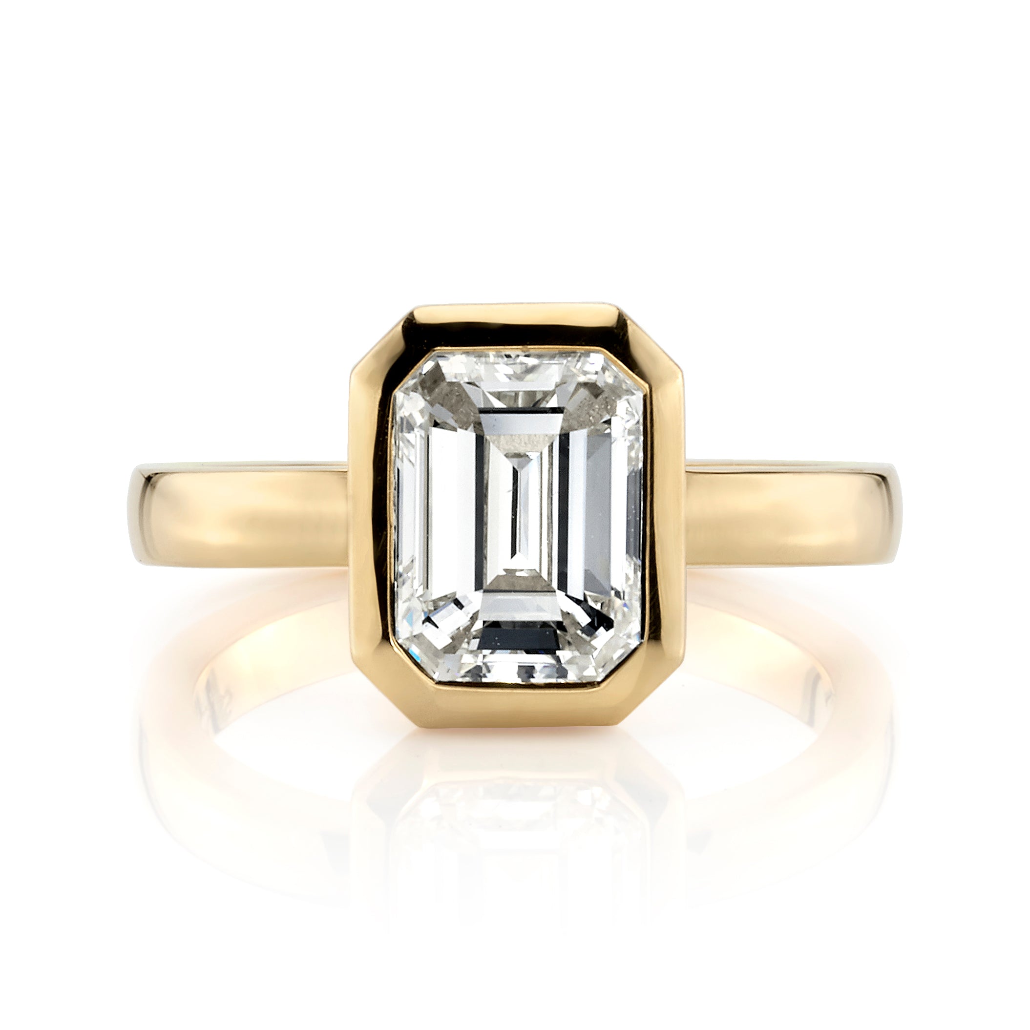 SINGLE STONE RAE RING featuring 2.03ct N/VS1 GIA certified emerald cut diamond bezel set in a handcrafted 18K yellow gold mounting.