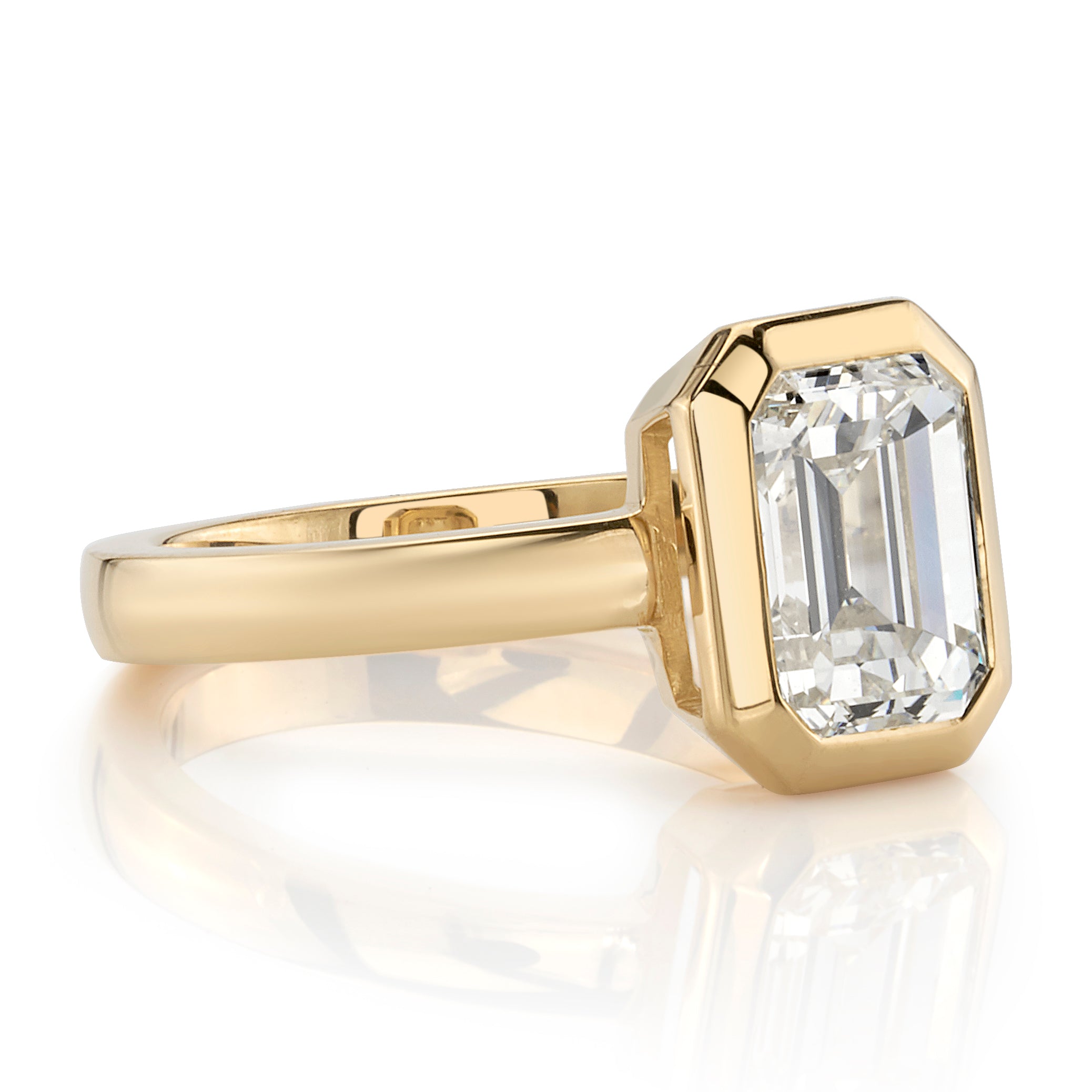 SINGLE STONE RAE RING featuring 2.03ct N/VS1 GIA certified emerald cut diamond bezel set in a handcrafted 18K yellow gold mounting.