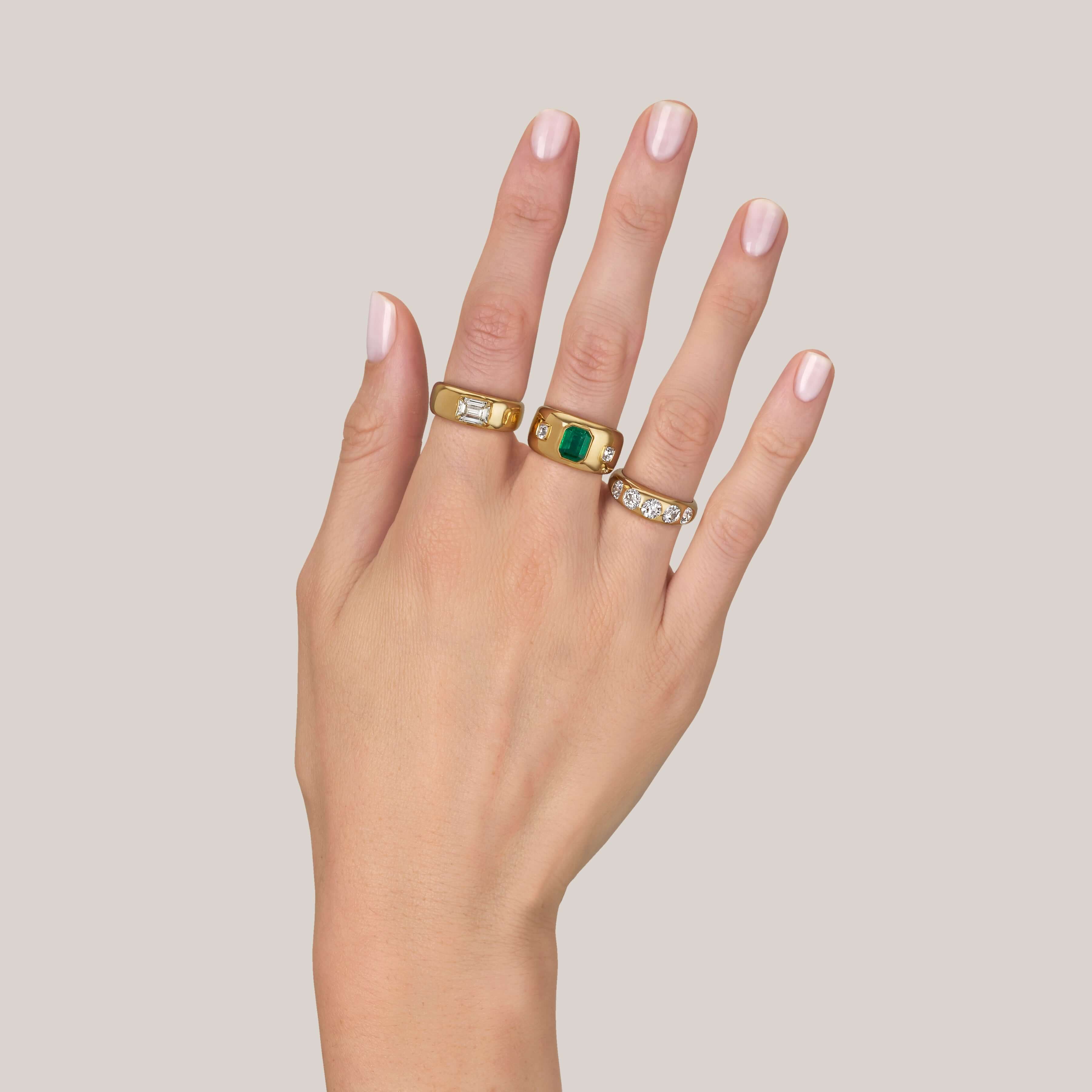 SINGLE STONE REMINGTON RING featuring 1.00ct U-V/SI1 GIA certified emerald cut diamond set in a handcrafted 18K yellow gold dome mounting.