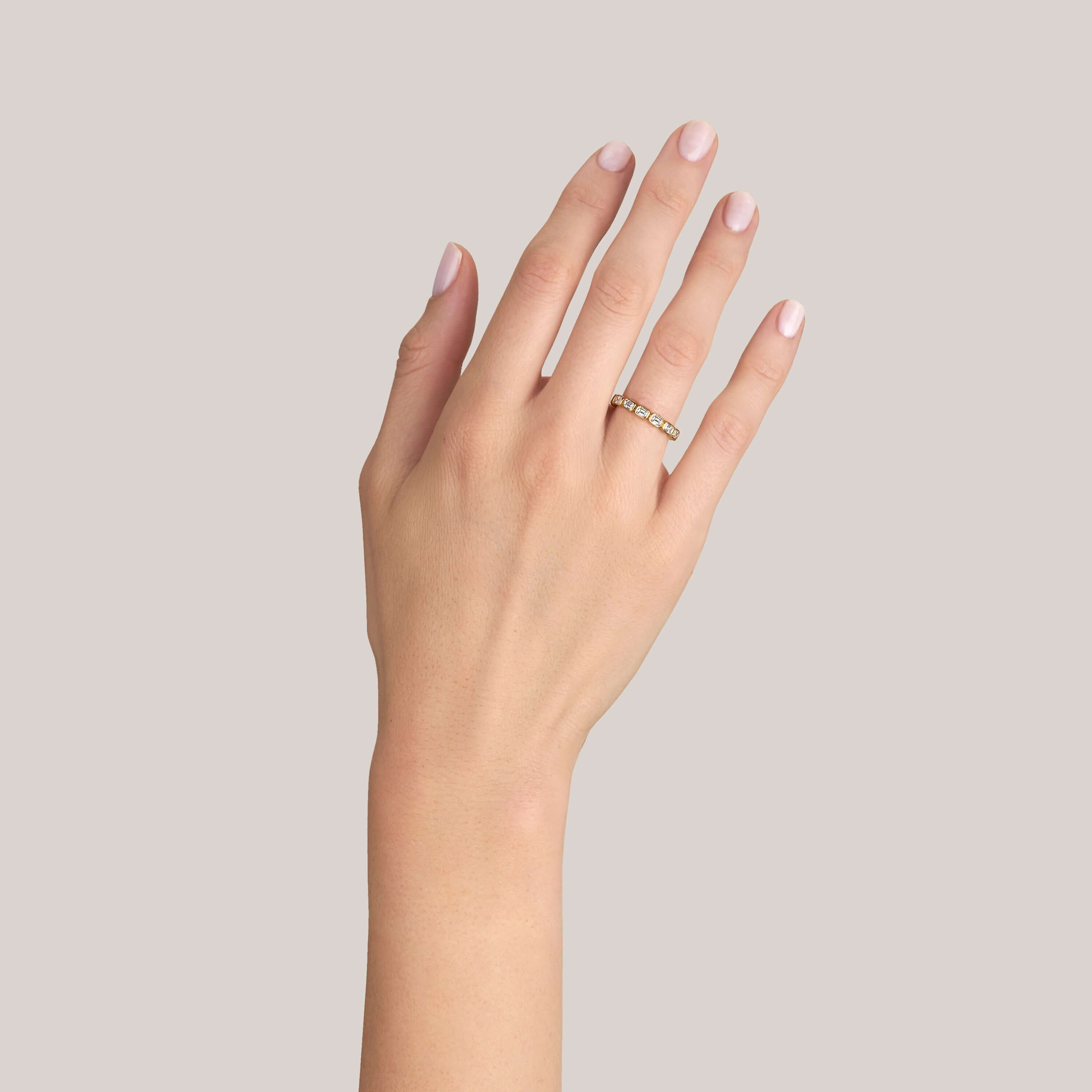 SINGLE STONE SIERRA BAND | Approximately 1.40ctw H-I/VS emerald cut diamonds bezel set in a handcrafted eternity band. Approximate band with 2.5mm. Please inquire for additional customization.