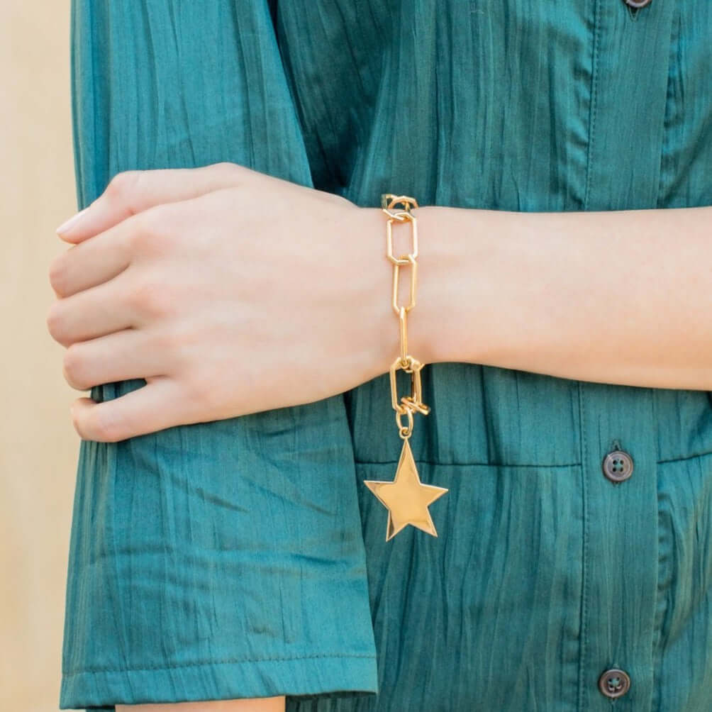 SINGLE STONE LARGE KINSLEY PENDANT featuring Handcrafted 18K yellow gold star charm. Charm measures 30mm x 40mm. Price does not include bracelet.