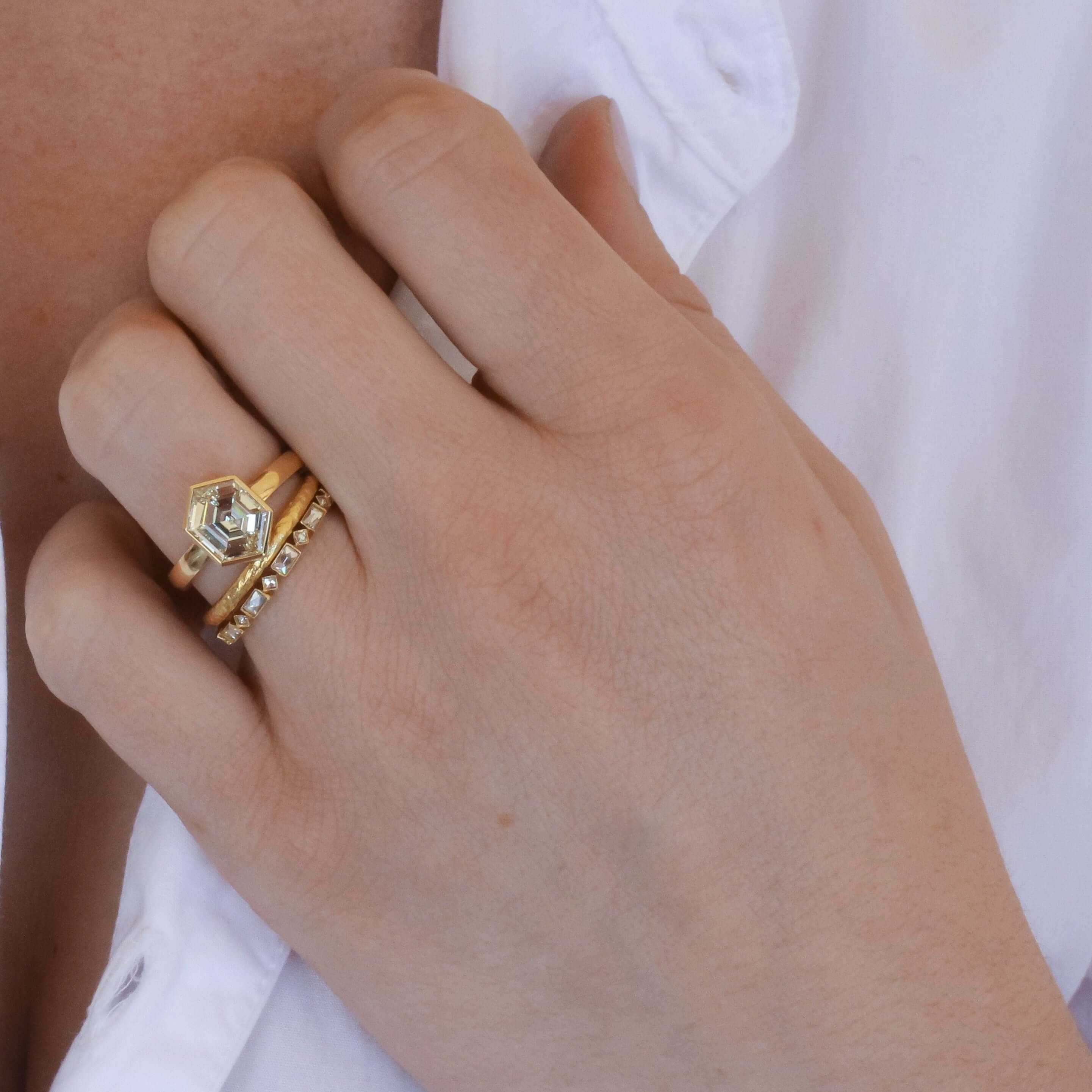 SINGLE STONE MADELINE BAND | Approximately 0.80-1.00ctw square and rectangular French cut diamonds bezel set in a handcrafted eternity band. Approximate band width 2.4mm. *Stone weight may vary from piece to piece. Please inquire for additional customizat