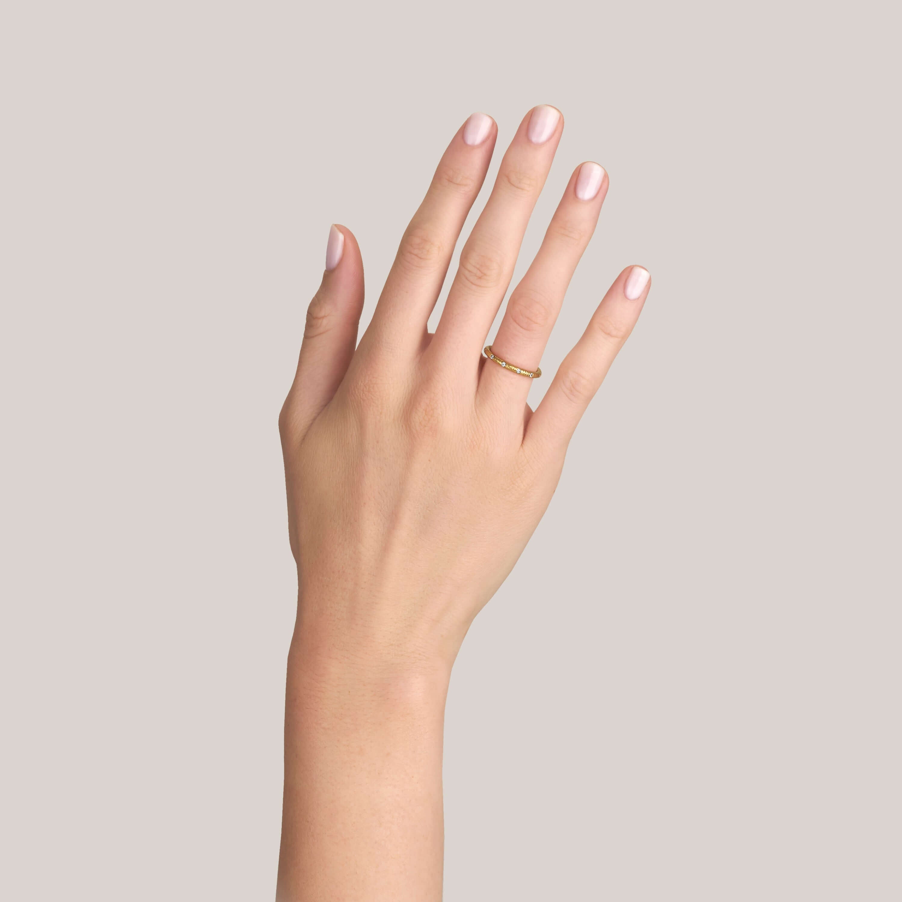 SINGLE STONE YORK BAND | Approximately 0.10ctw G-H/VS old European cut diamonds set in a handcrafted 22K yellow gold hammer finished band. Approximate band with 2mm. Please inquire for additional customization.