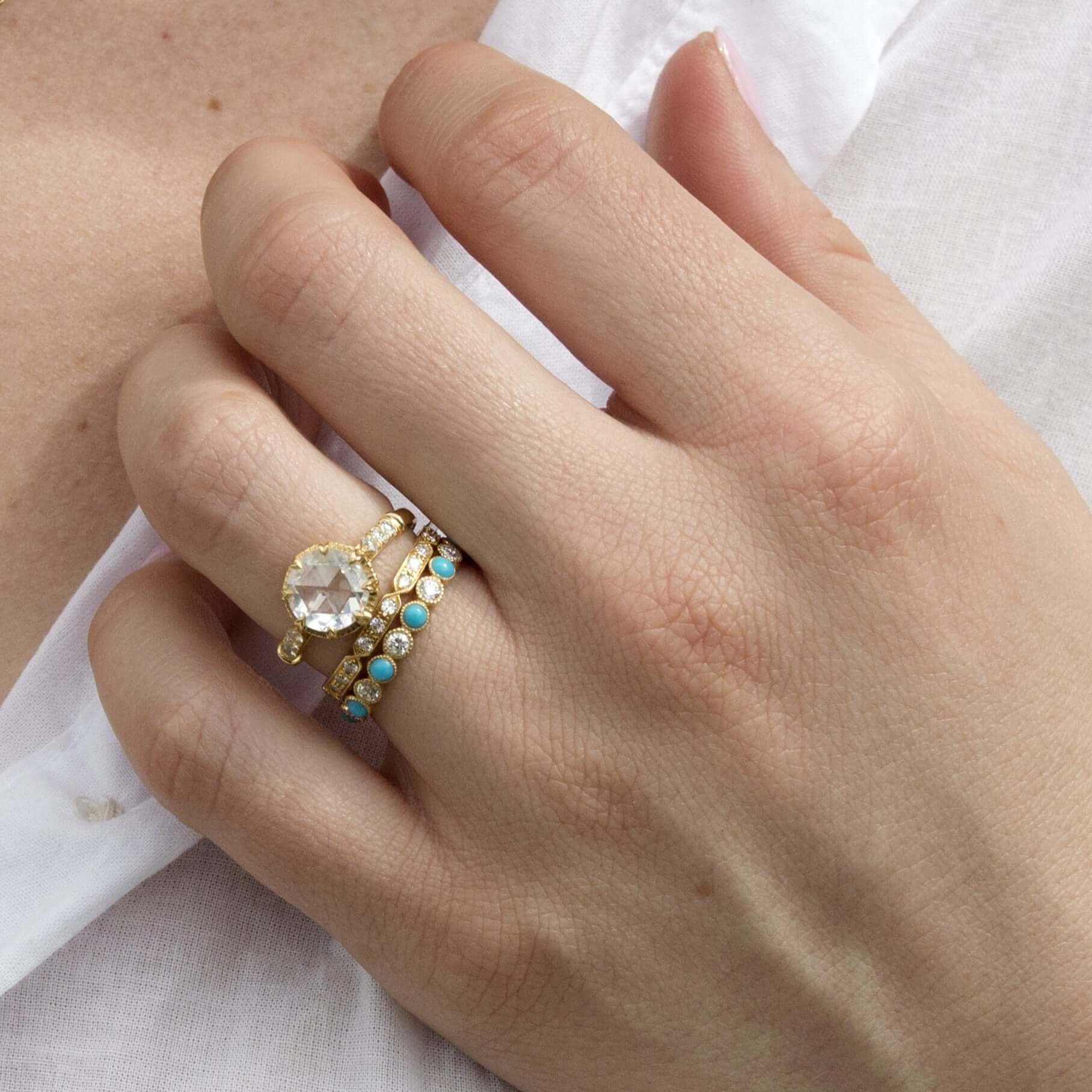 SINGLE STONE CARLY BAND | Approximately 0.30ctw G-H/VS old European cut diamonds prong set in a handcrafted geometric sectional eternity band. Approximate band width 2.1mm. Please inquire for additional customization.