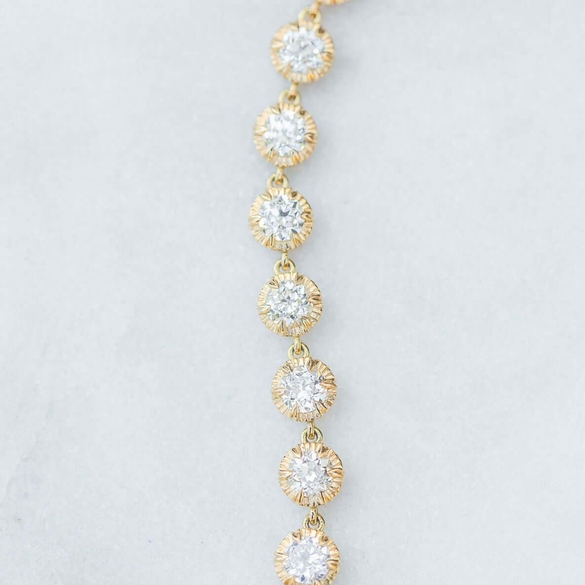 SINGLE STONE ARIELLE BRACELET featuring 4.82ctw G-H/VS-SI old European cut diamonds set in a handcrafted 18K yellow gold diamond tennis bracelet.