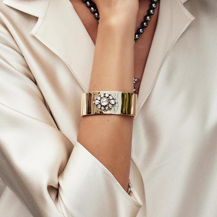 Woman's arm wearing Single Stone's Ashlyn cuff bracelet featuring 2.50ct rose cut diamond with 2.25ctw rose cut diamond surround set in an oxidized silver mounting