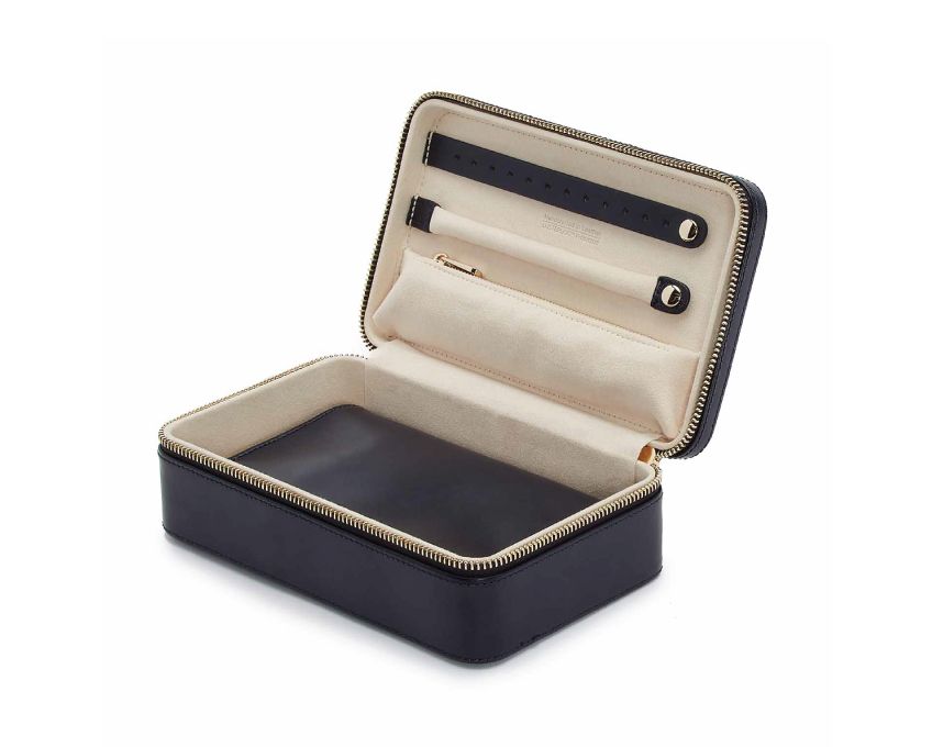 Single Stone's MARIA MEDIUM ZIP CASE - NAVY  featuring Material: Leather Storage: 1 earring tab, 1 ring tab, 1 zip pocket, double multi-purpose zip pouch with 4 storage compartments, 3 snap-on necklace hooks with pocket. LusterLoc™: Allows the fabric lining the inside of your jewellery cases to absorb the hostile gases known to cause tarnishing. Under typical storage condi
