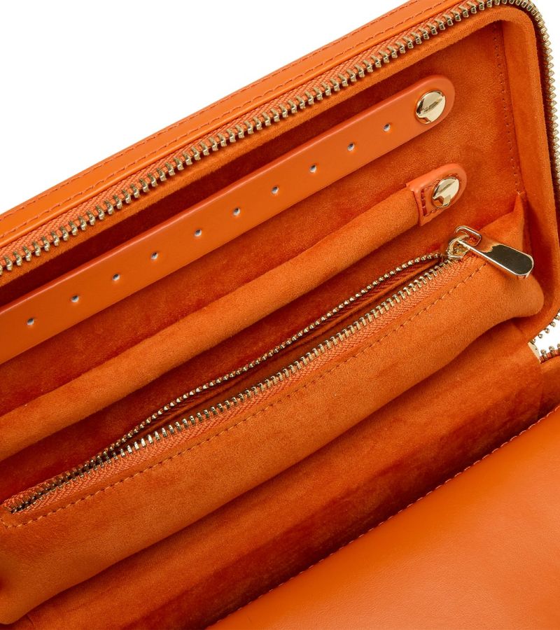 Single Stone's MARIA MEDIUM ZIP CASE - TANGERINE  featuring Material: Leather Storage: 1 earring tab, 1 ring tab, 1 zip pocket, double multi-purpose zip pouch with 4 storage compartments, 3 snap-on necklace hooks with pocket. LusterLoc™: Allows the fabric lining the inside of your jewellery cases to absorb the hostile gases known to cause tarnishing. Under typical storage condi
