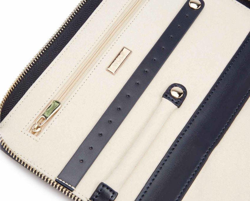 MARIA JEWELRY PORTFOLIO, Material: Leather 
Storage: 1 earring tab, 1 ring tab, 2 zip compartments, 4 snap-on necklace hooks with pocket 
LusterLoc™: Allows the fabric lining the inside of your jewellery cases to absorb the hostile gases known to cause tarnishing. Under typical storage conditions, it can prevent tarnishing for up to 35 years 
8.75" L X 5.25" W X 1.25" H 
, Gifts, WOLF DESIGNS, INC